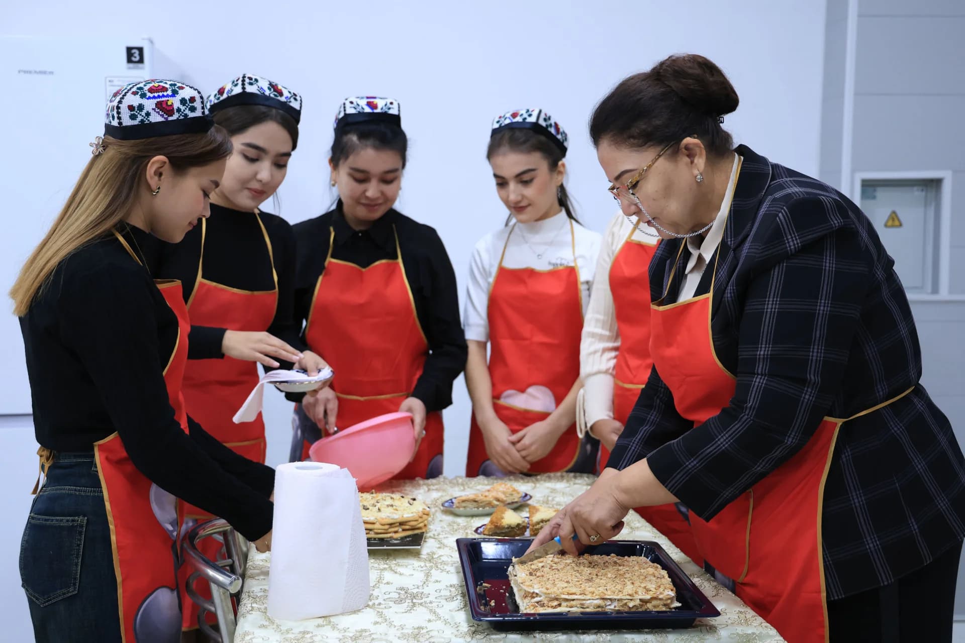 Women preparing traditional baked goods
