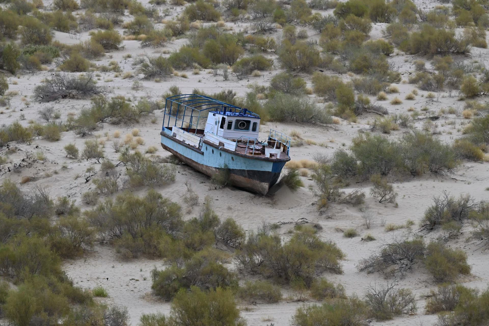 Abandoned ship in a sandy desert landscape