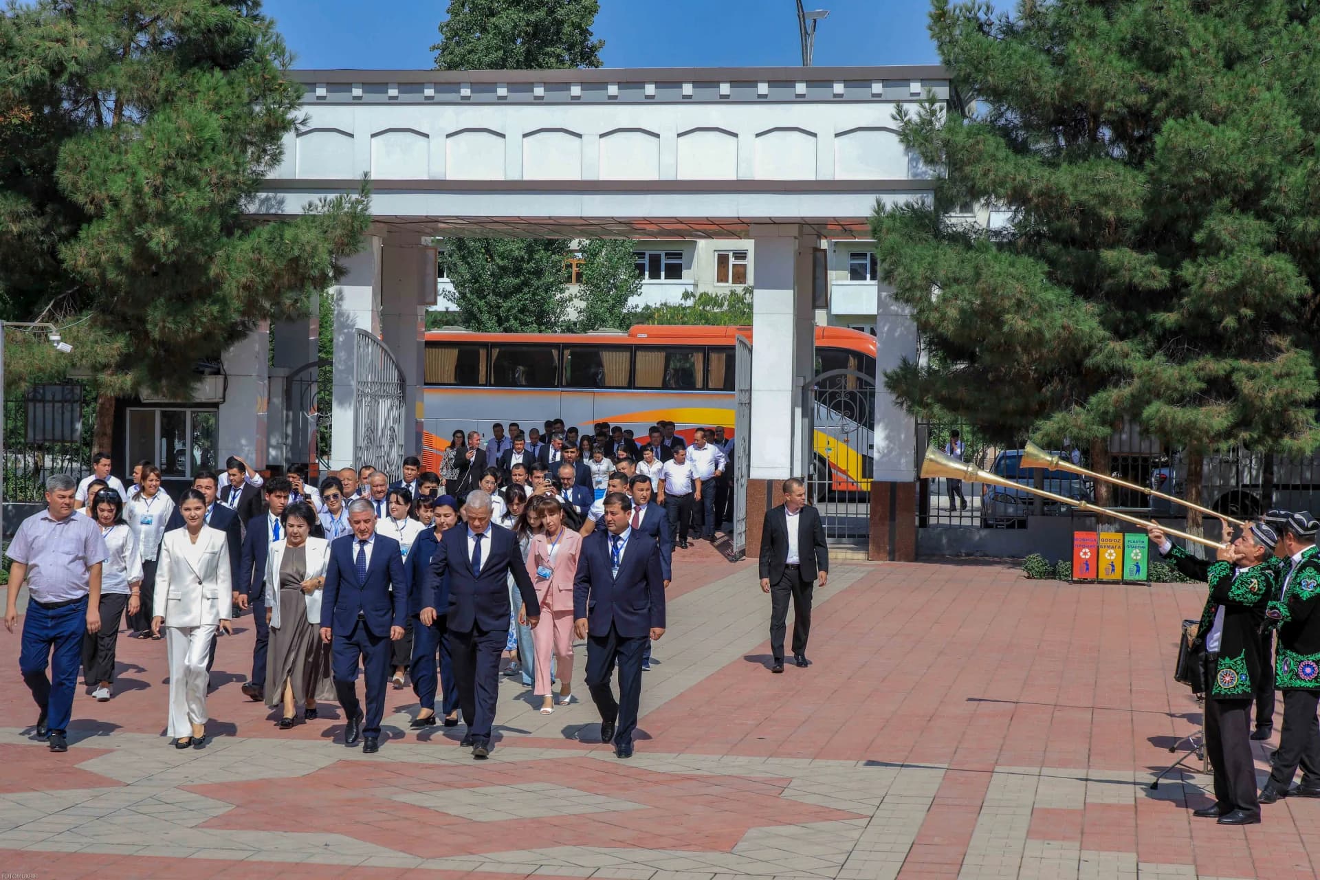 Group of people walking outdoors near a building