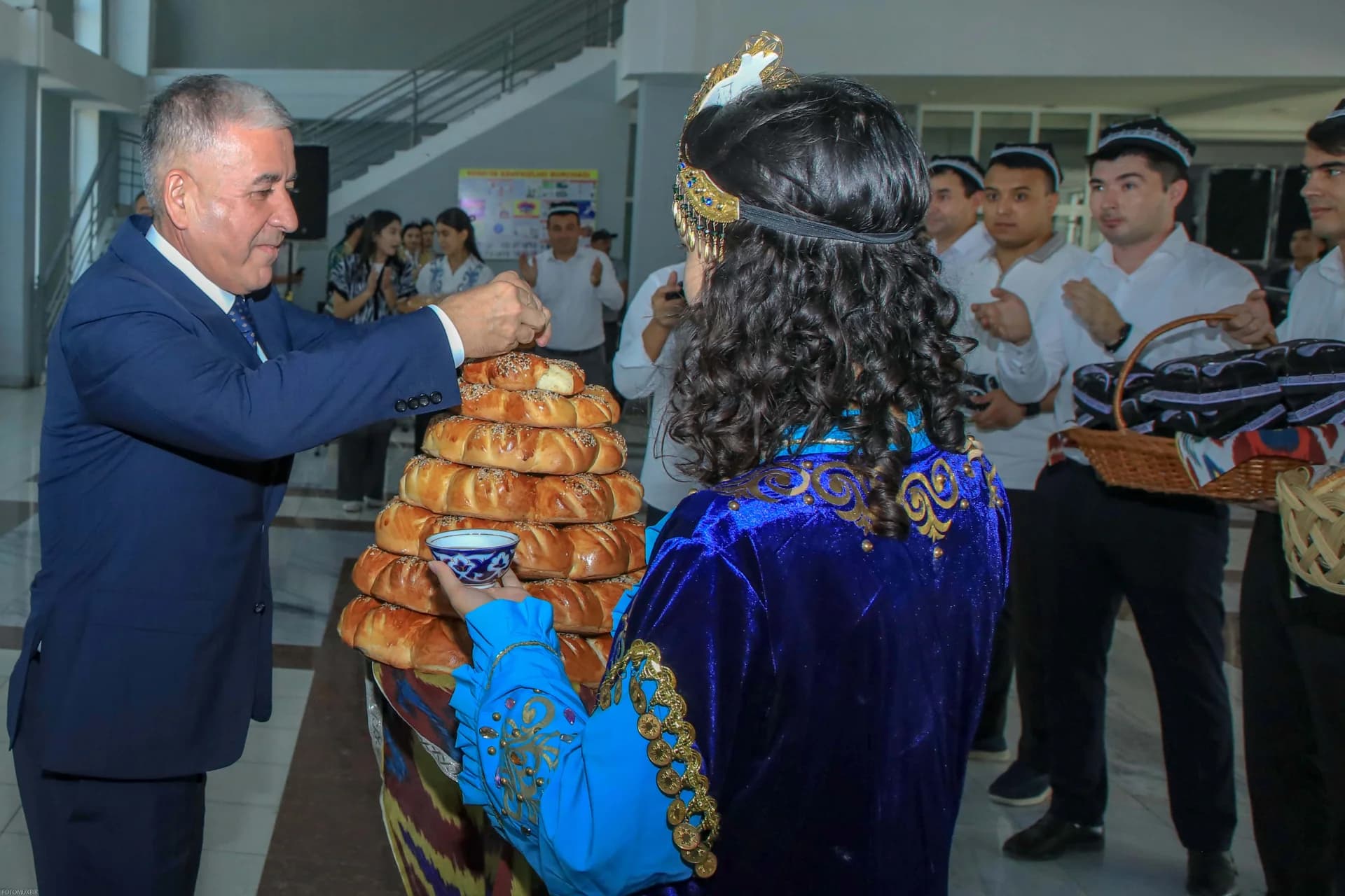 People taking part in traditional greeting ceremony with bread