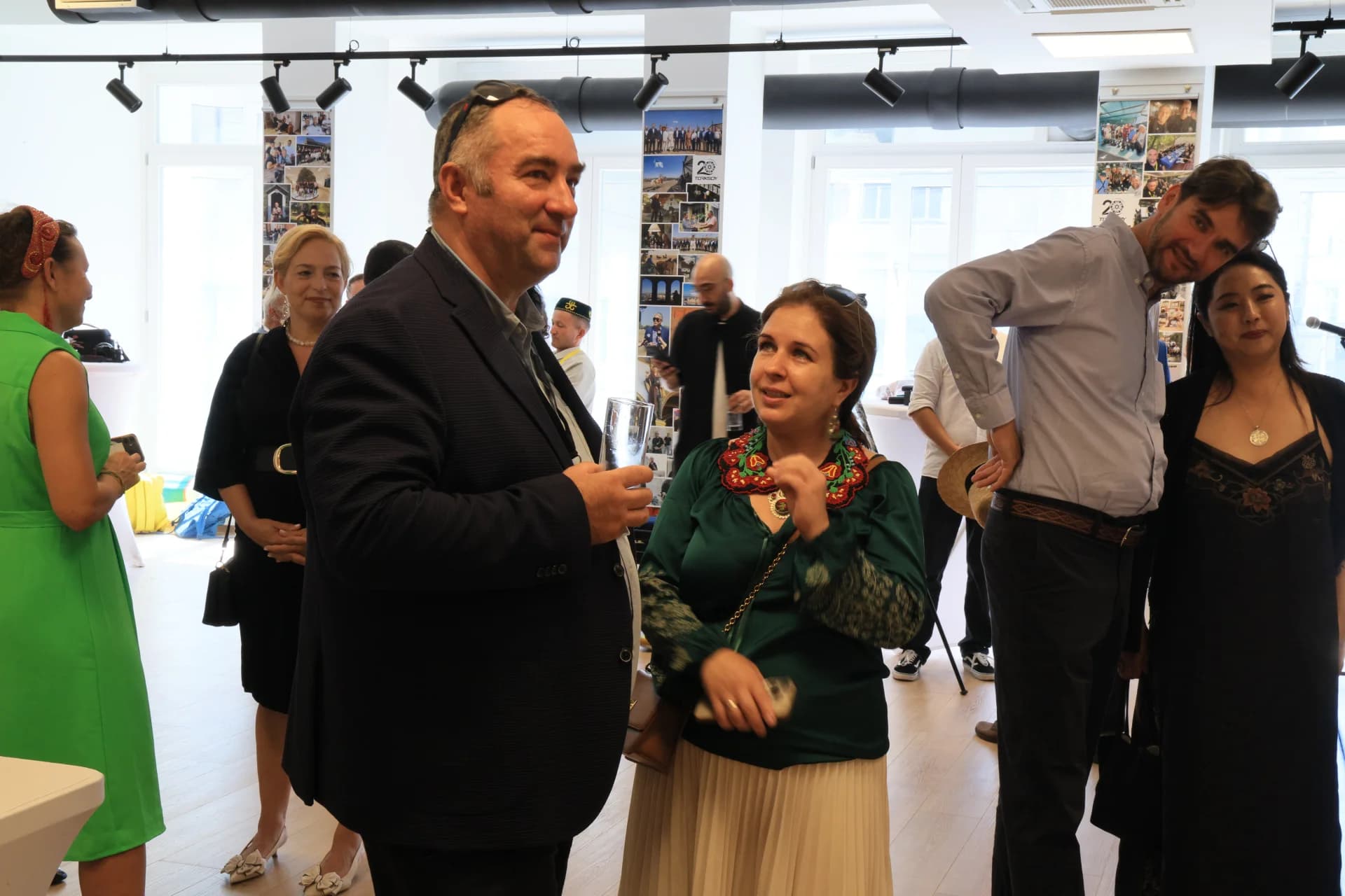 People gathered in a bright indoor room for an event