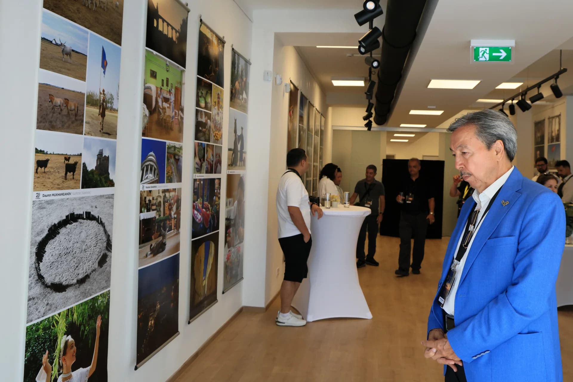 People viewing photography exhibition in gallery