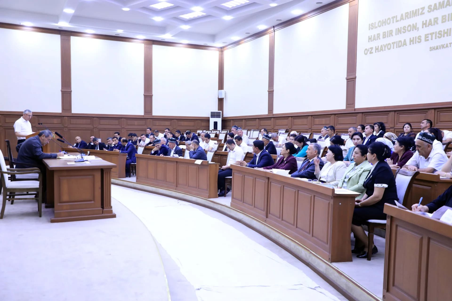 People attending a meeting in a conference hall