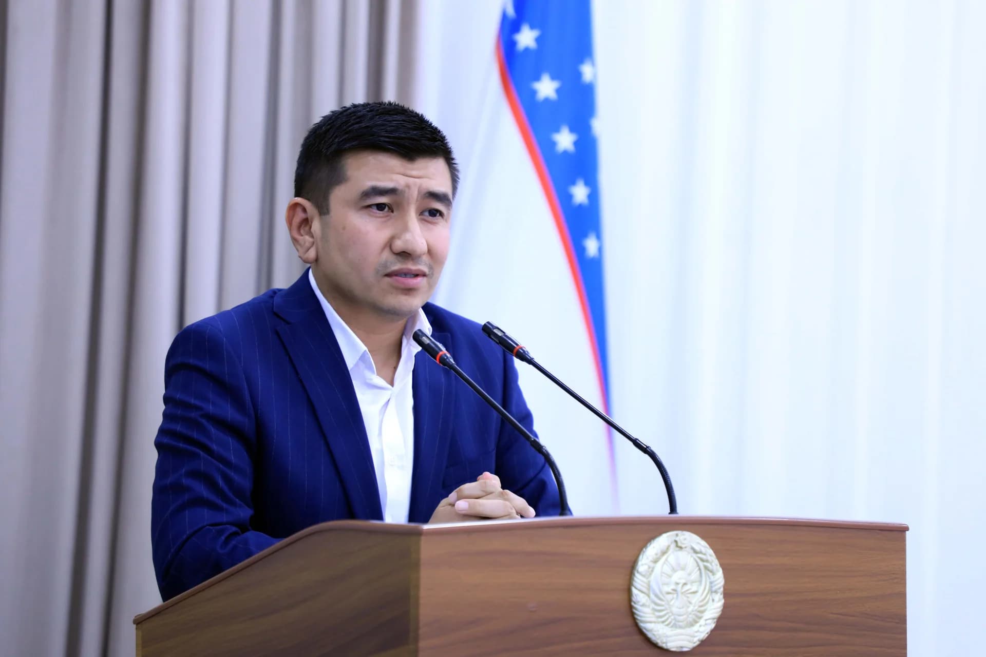 Man speaking at a podium