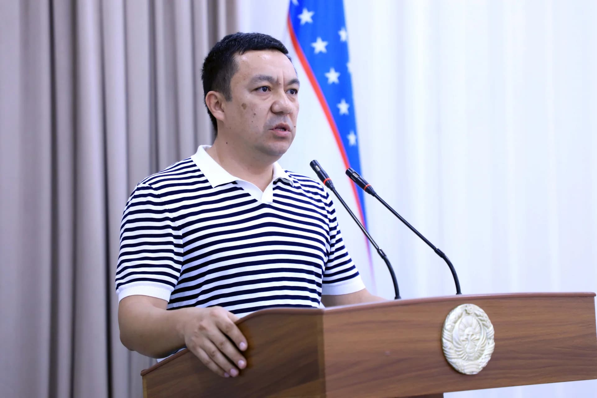 Man speaking at a podium