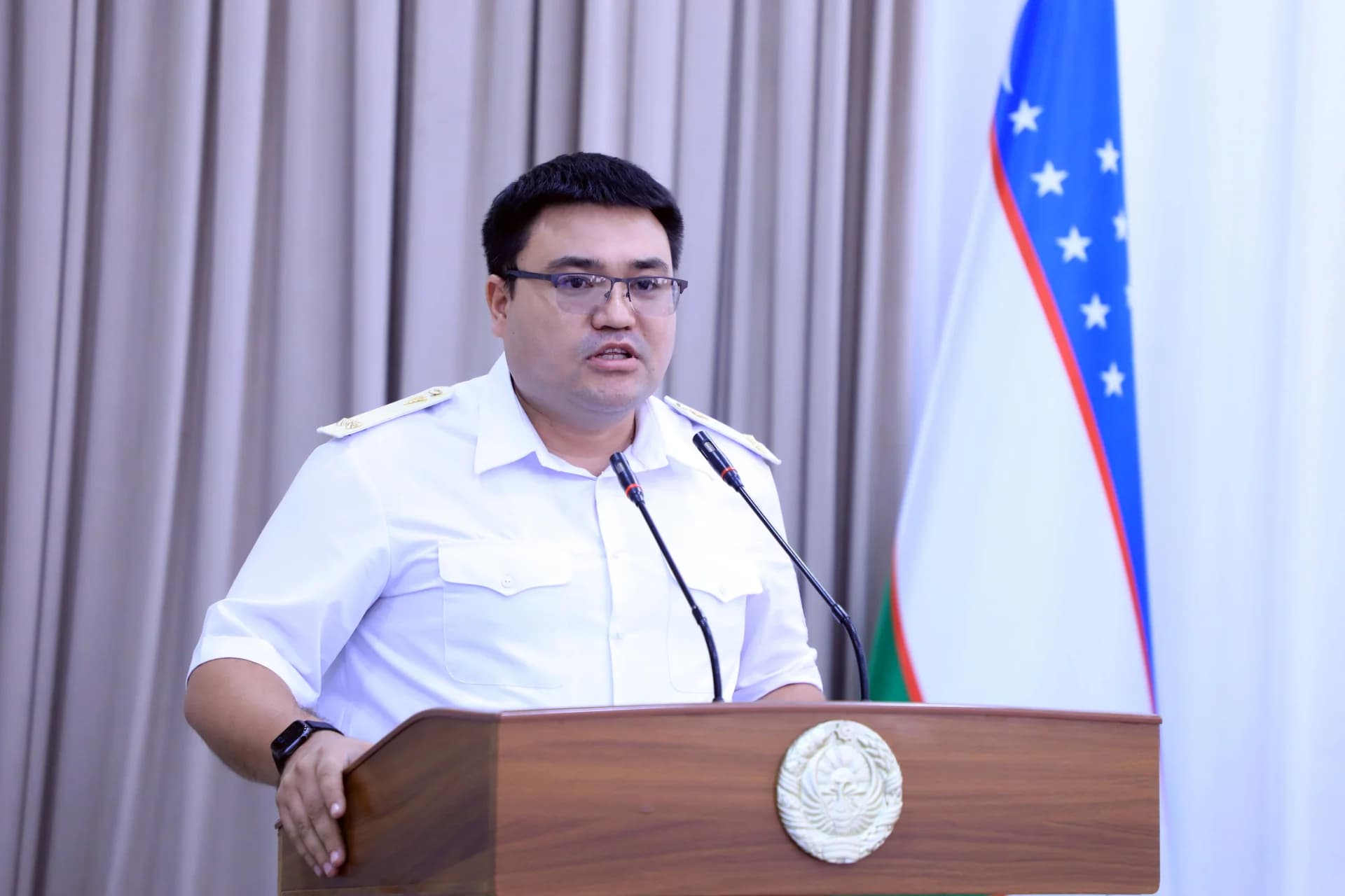 Man speaking at a podium