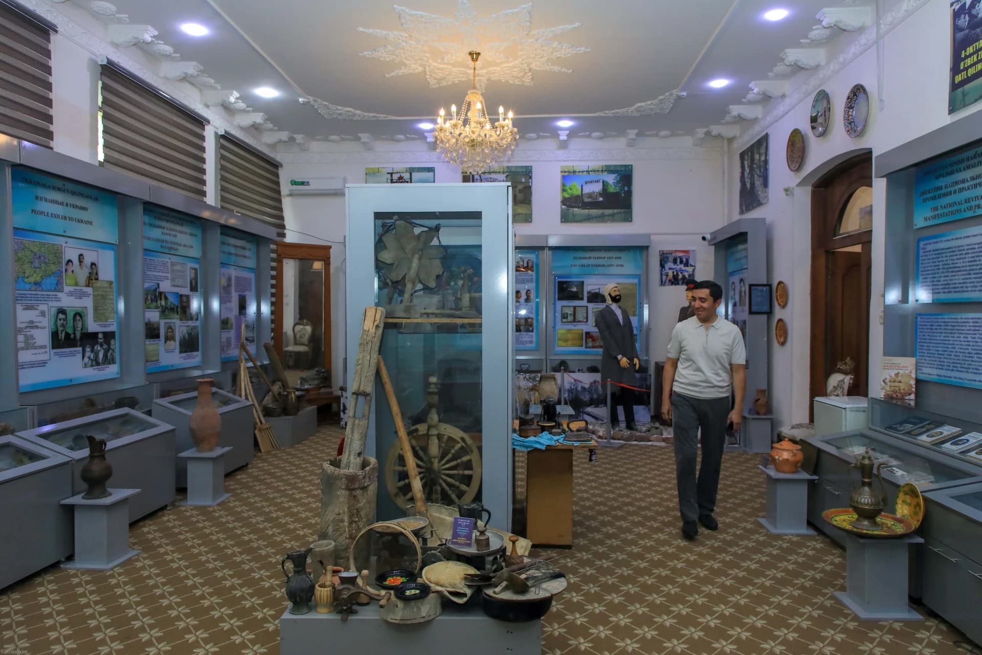 Visitor walking through museum exhibition hall