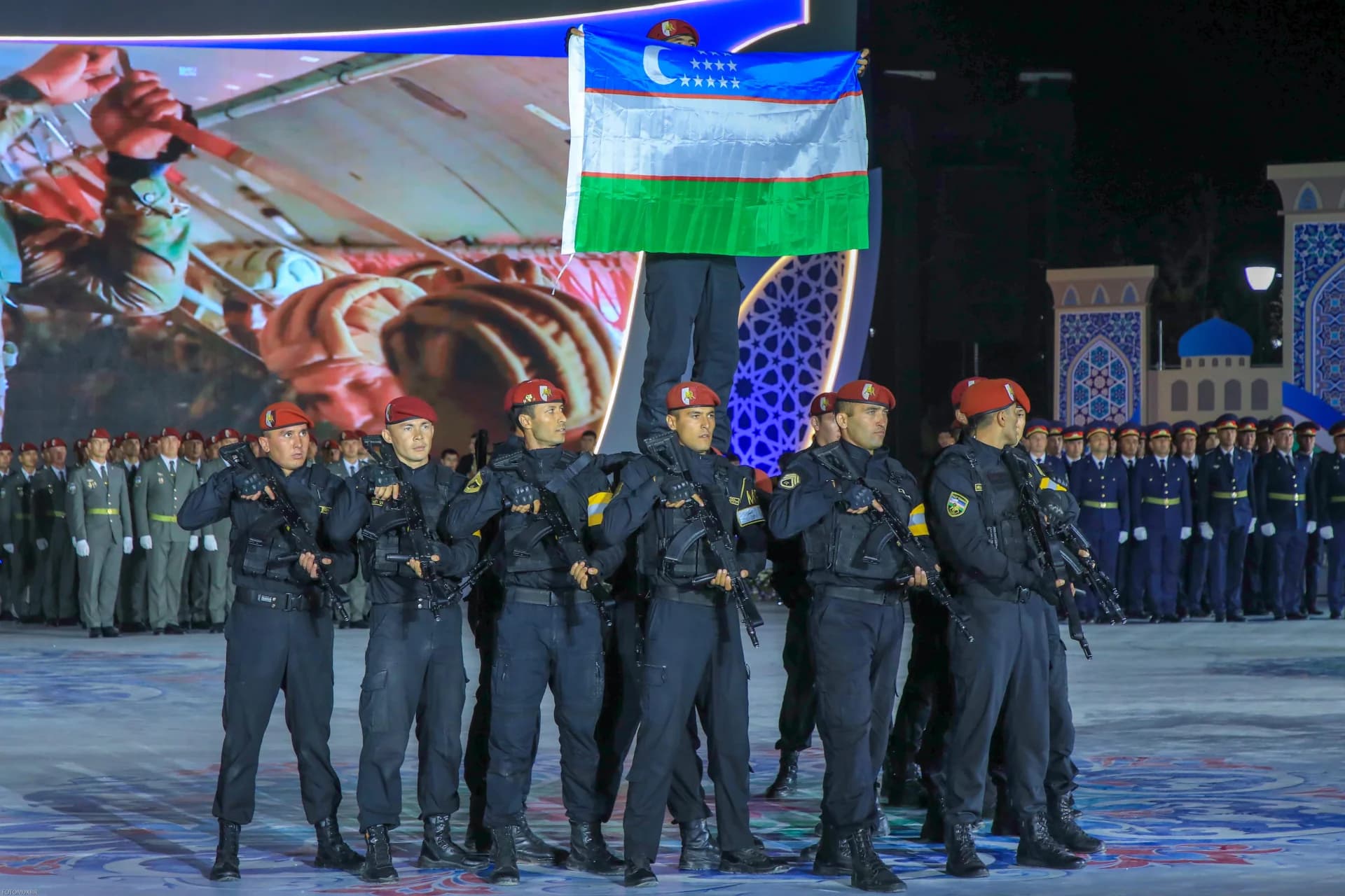 People in uniform holding a flag