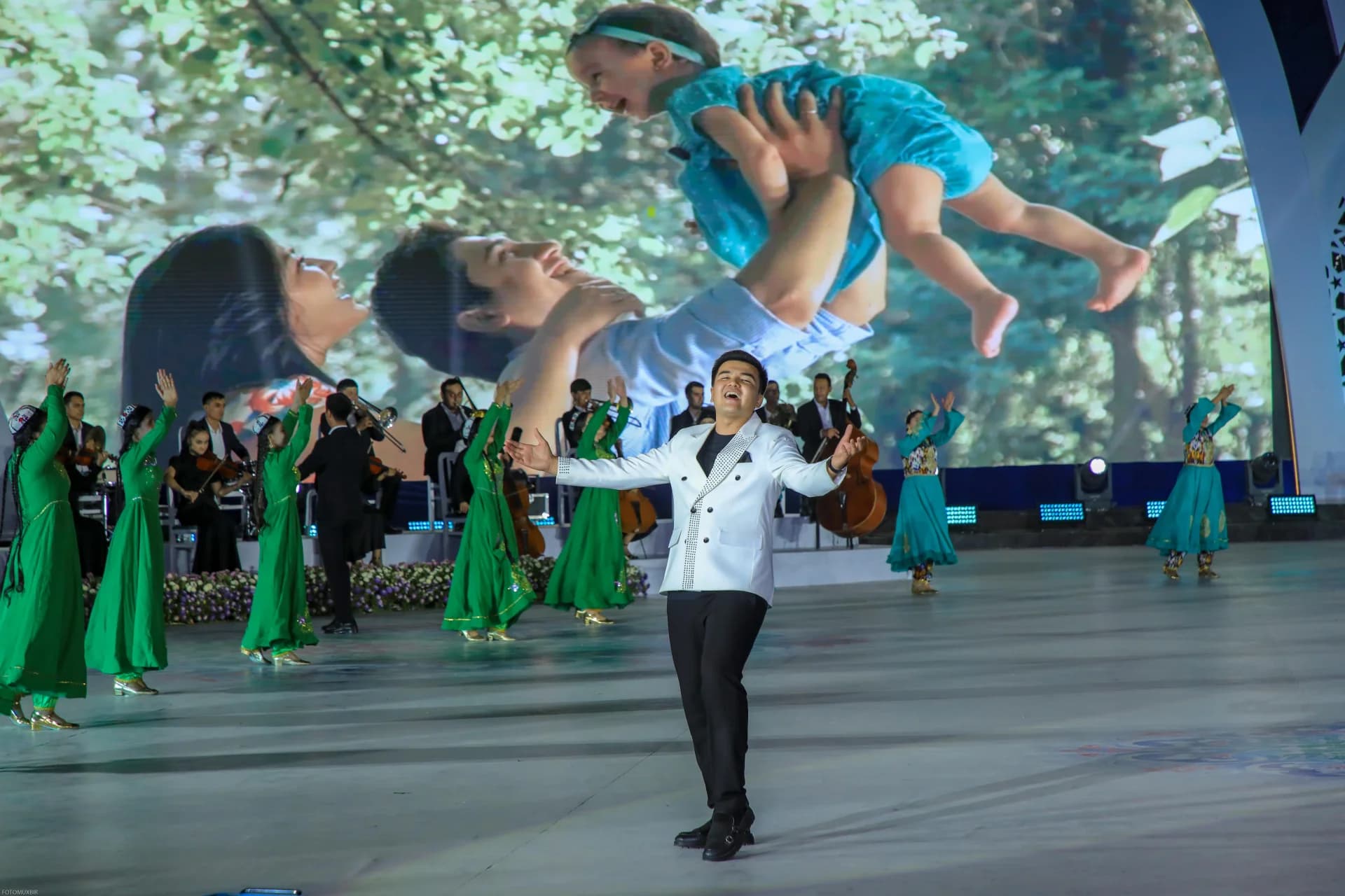 Performer singing on stage during an event
