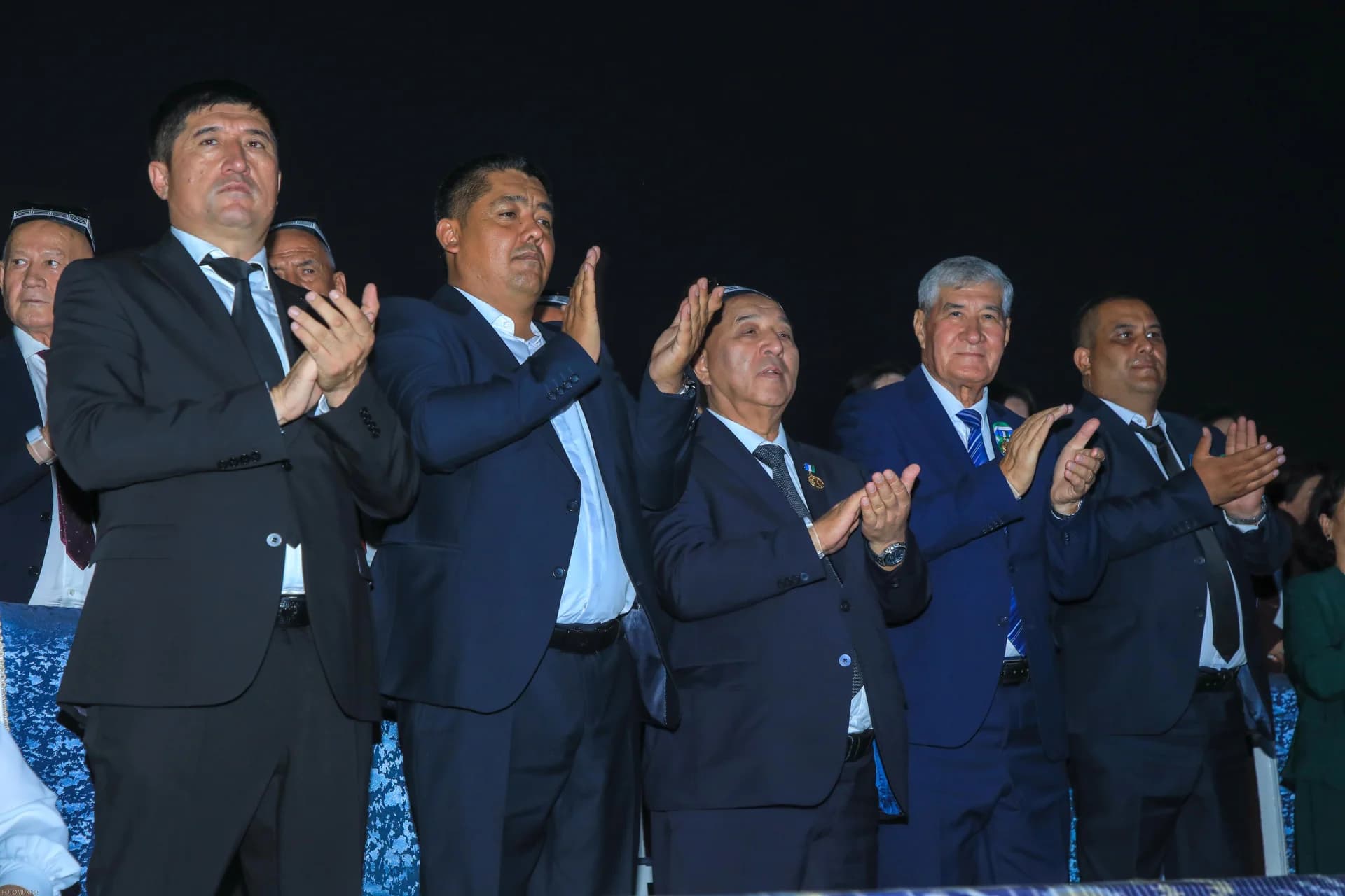 Group of men clapping