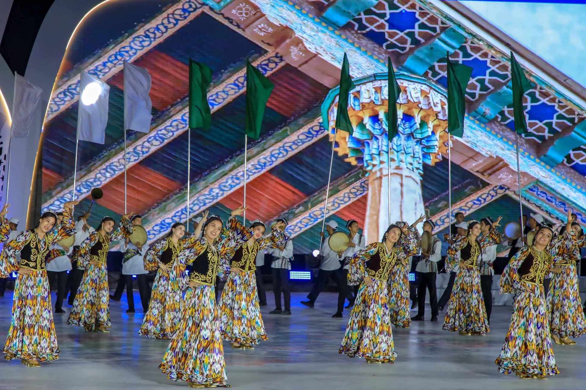 Performers in traditional attire dancing on stage