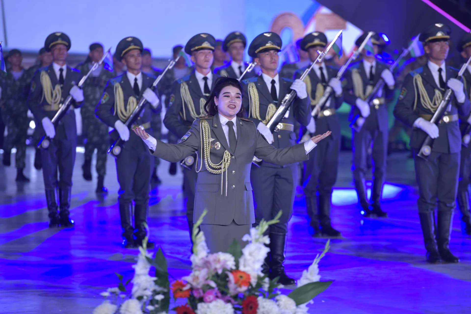 People in military uniforms performing on stage