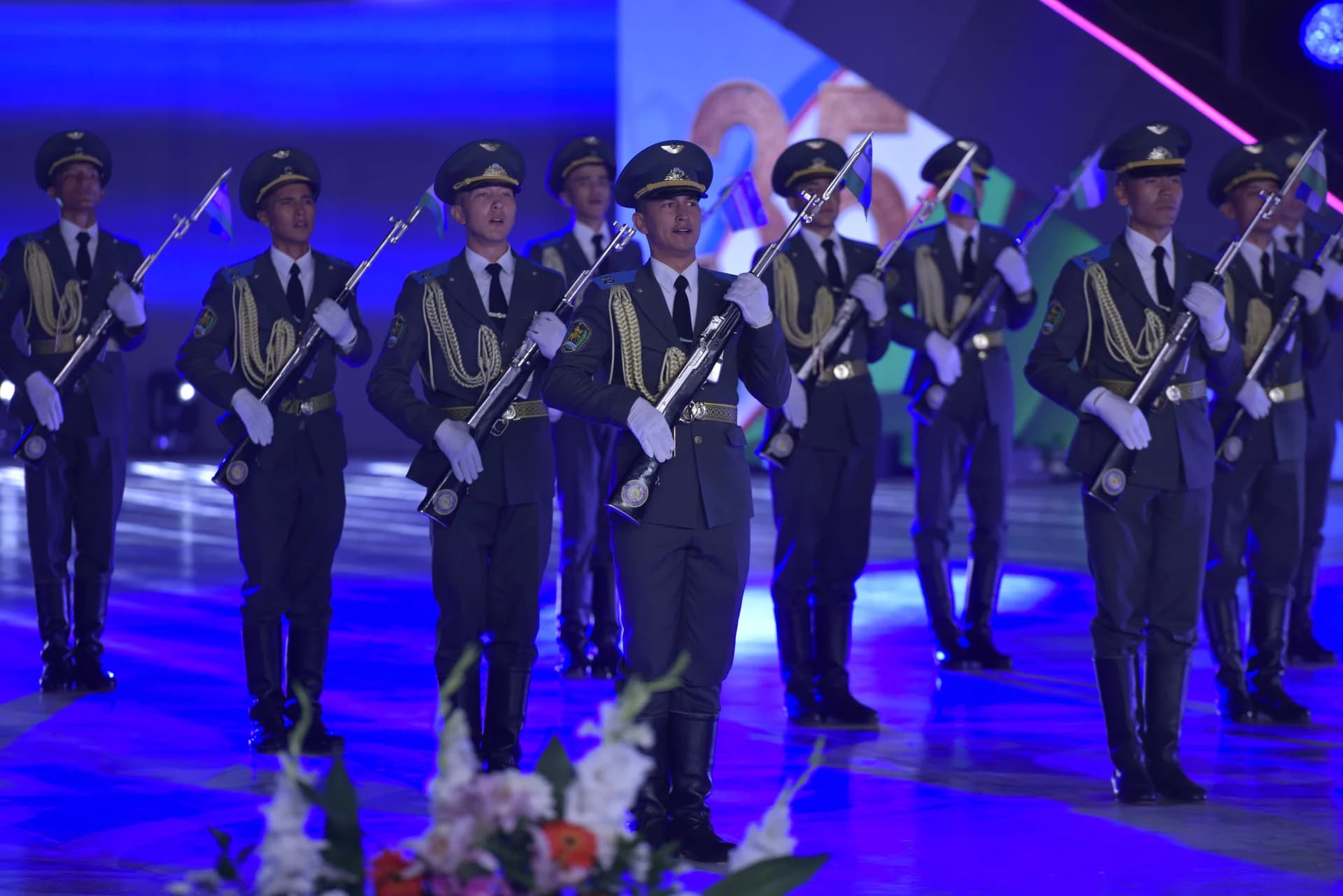 People in uniform holding rifles
