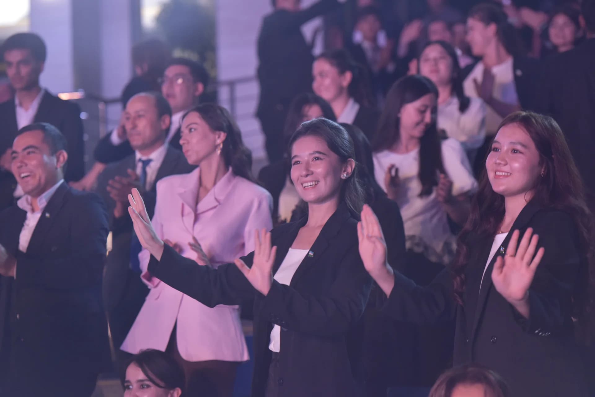 People clapping in an audience