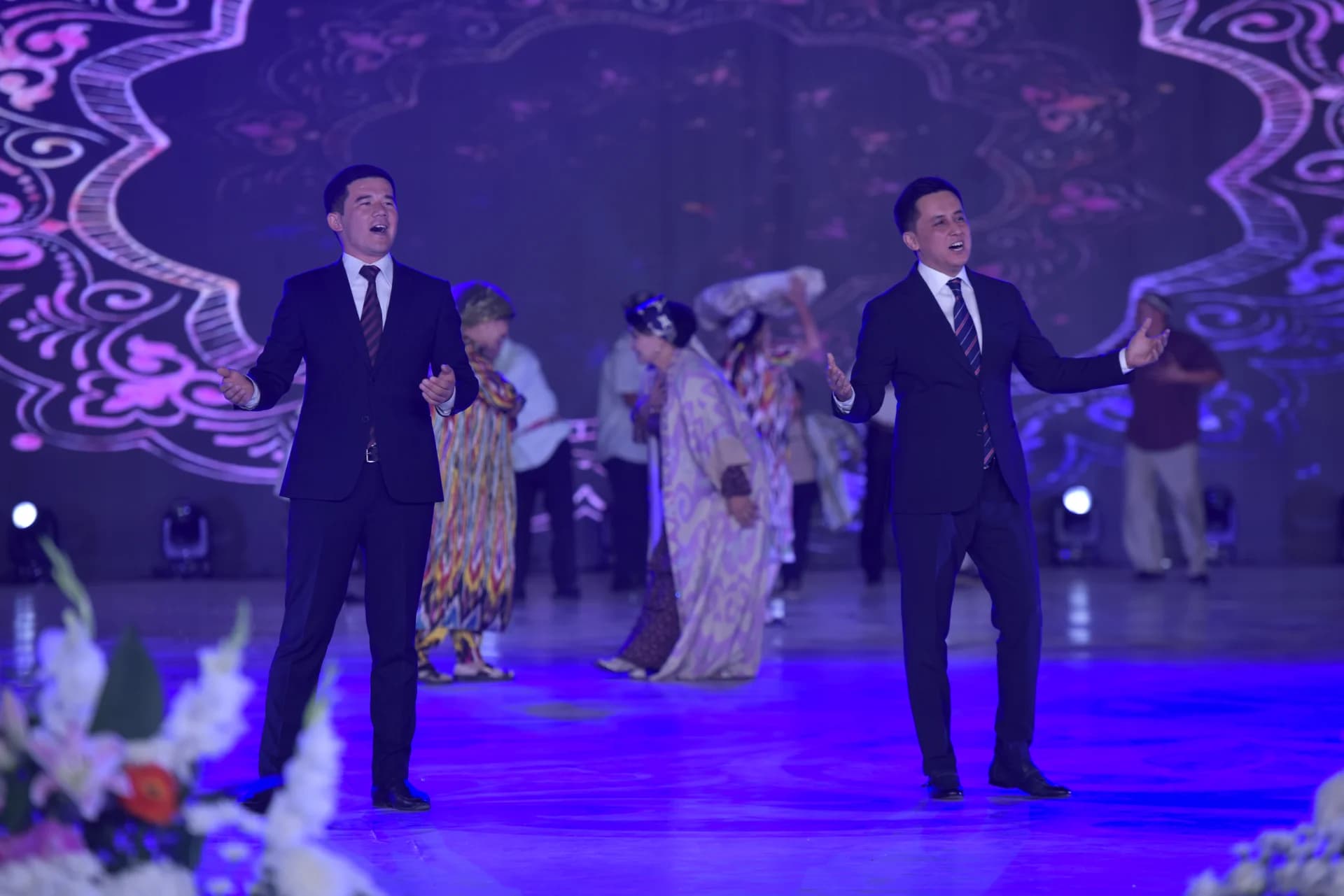Men performing on stage