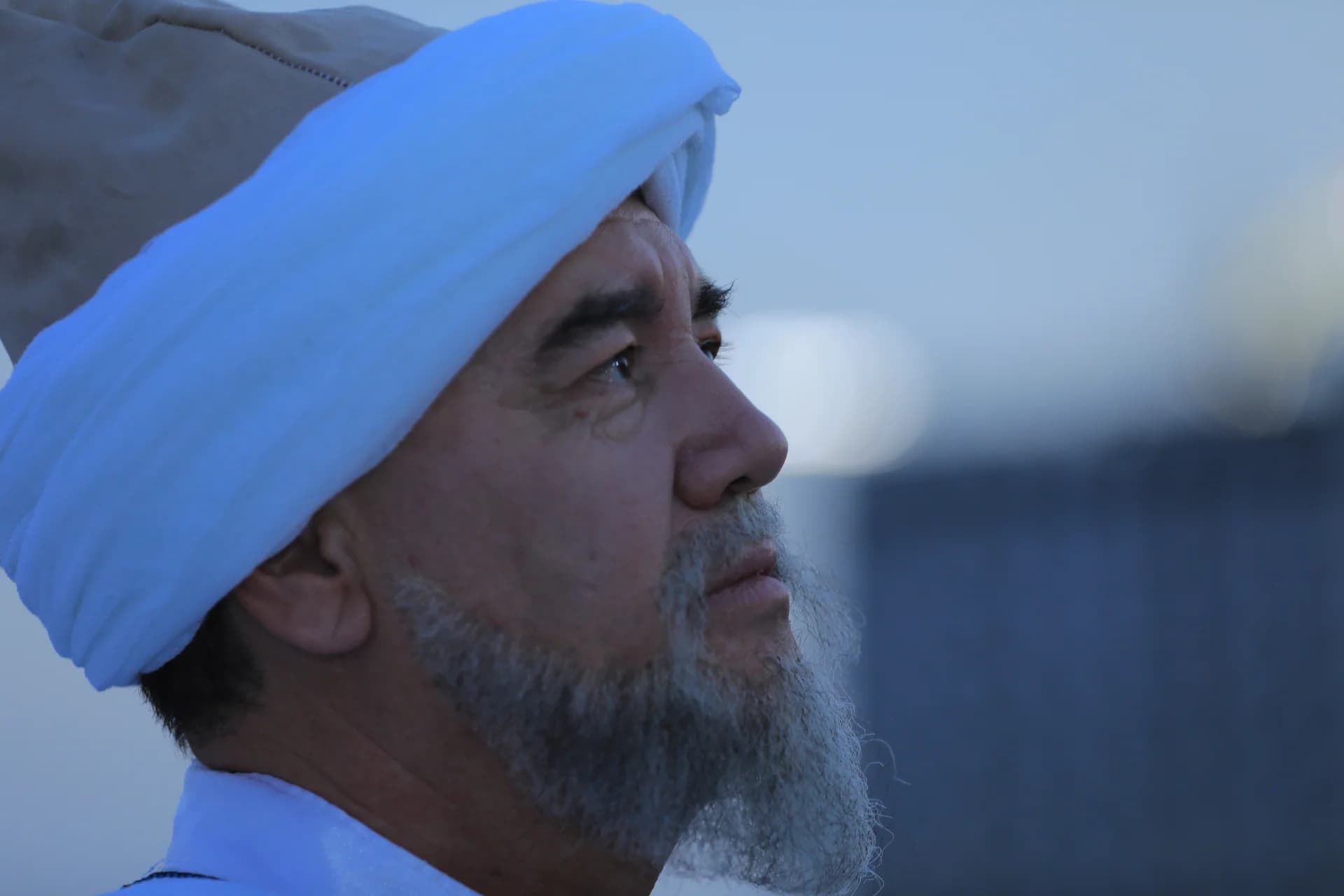 Close-up profile of a senior man wearing a turban