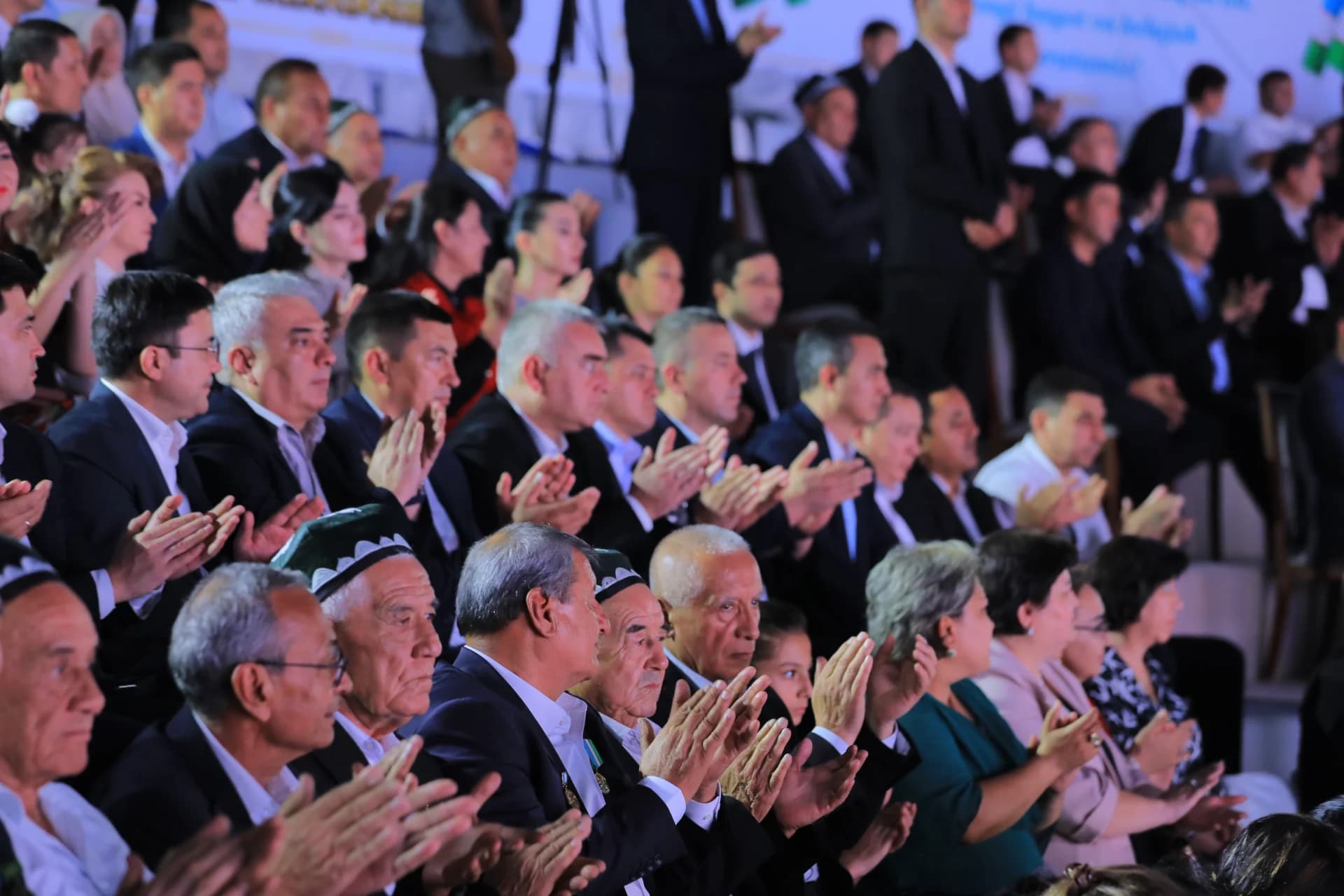 People clapping in an audience