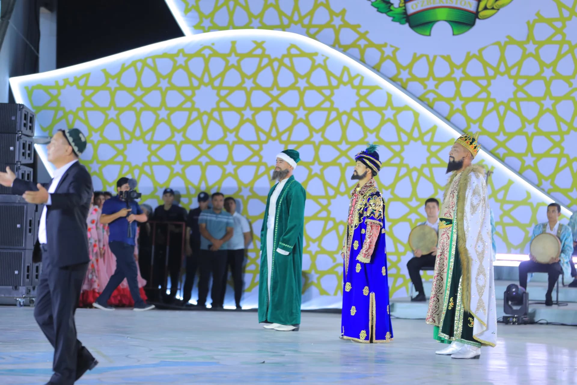 Performers in traditional historical attire on stage