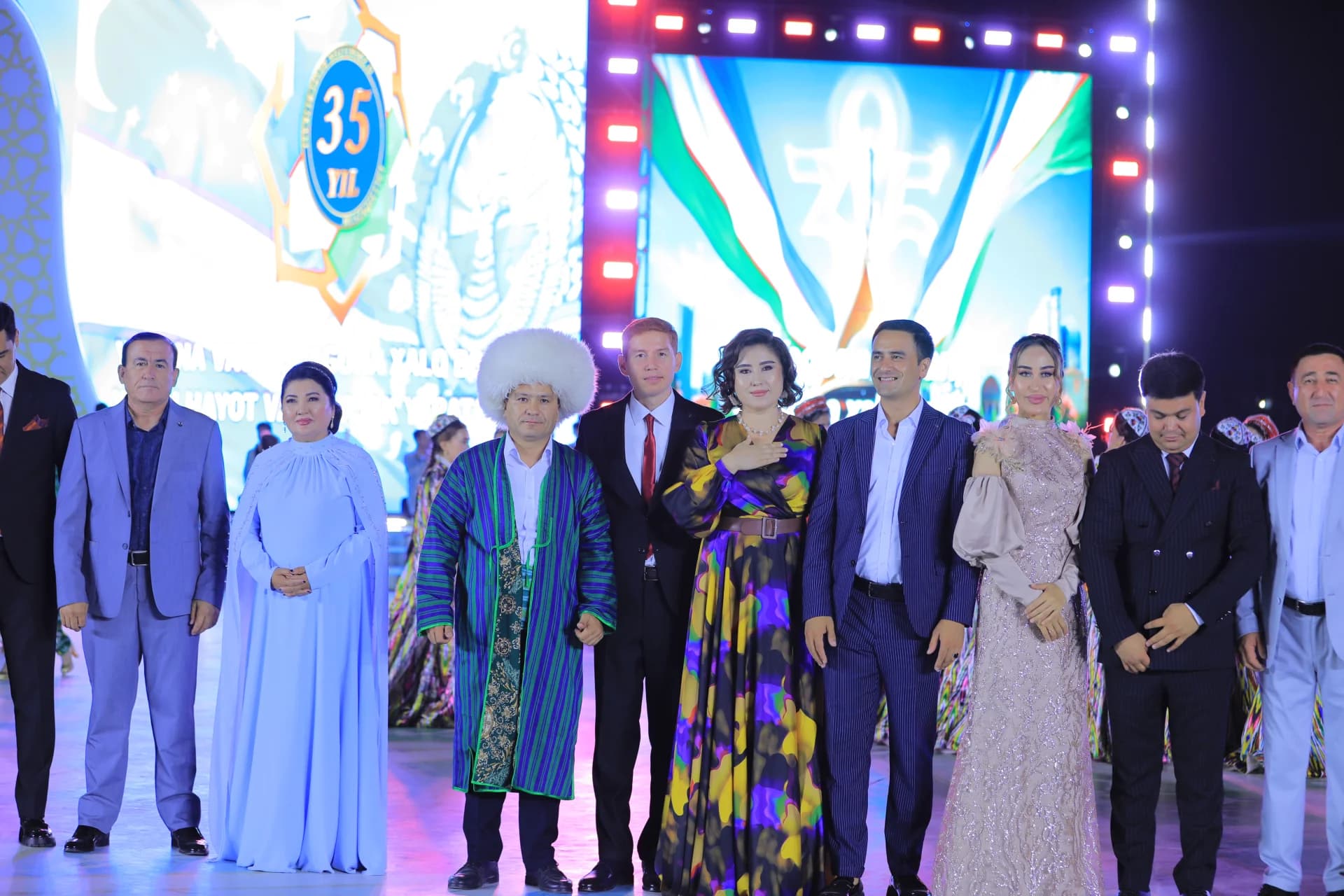 Group of people standing on a stage at an event