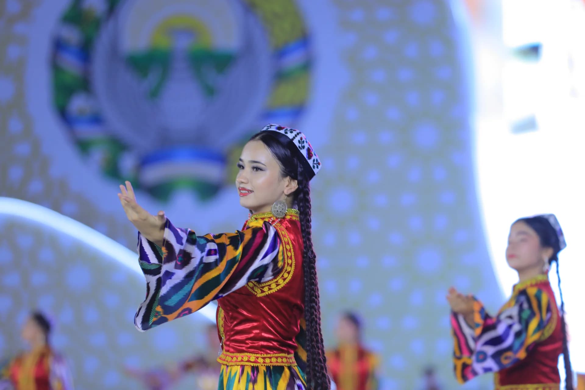 Performers in traditional attire dancing on stage