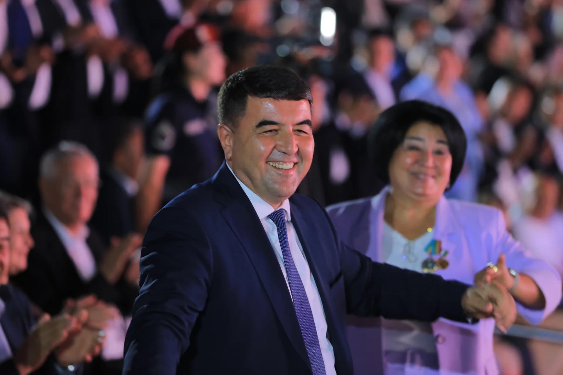 People smiling at an event