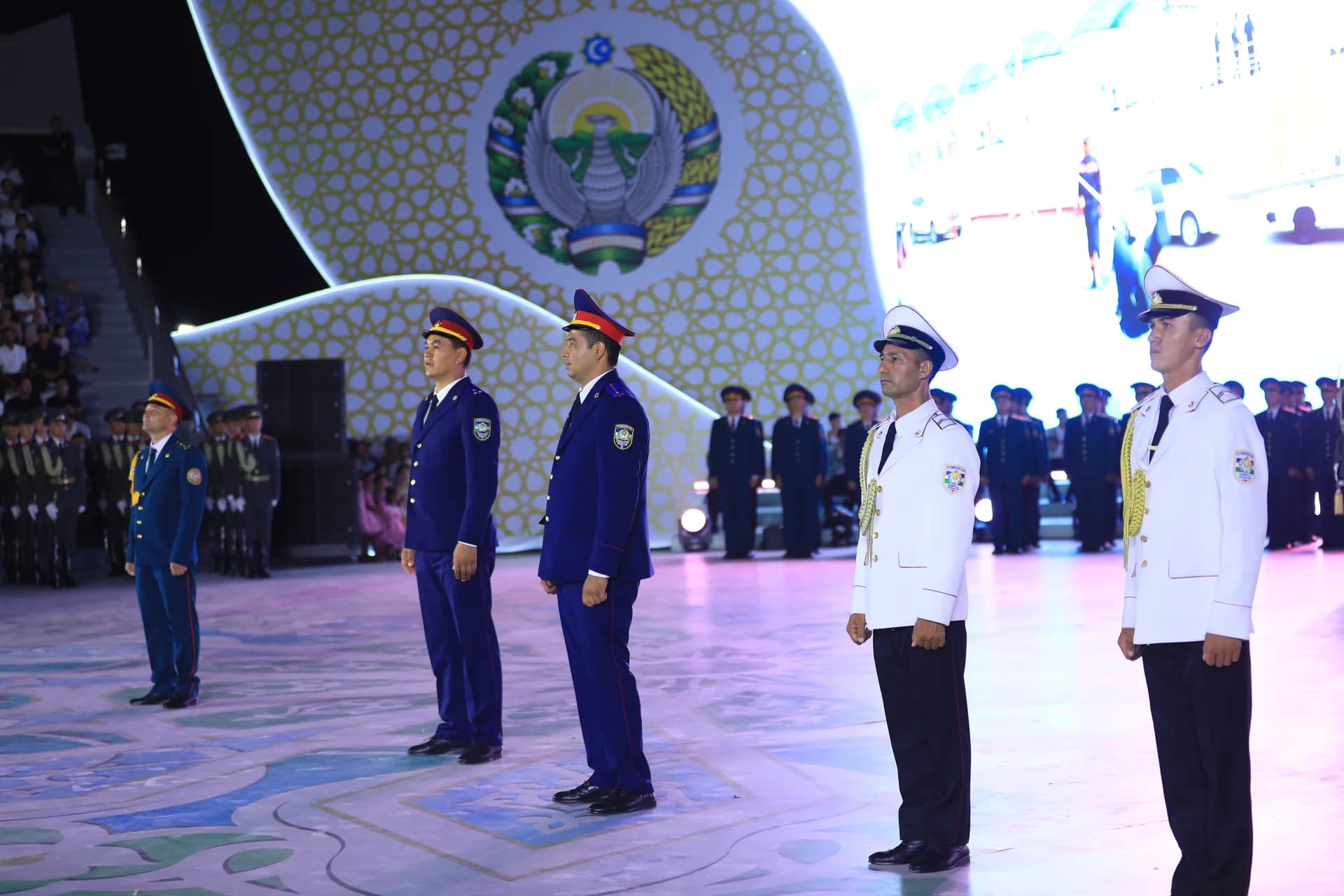 People in uniform standing on stage