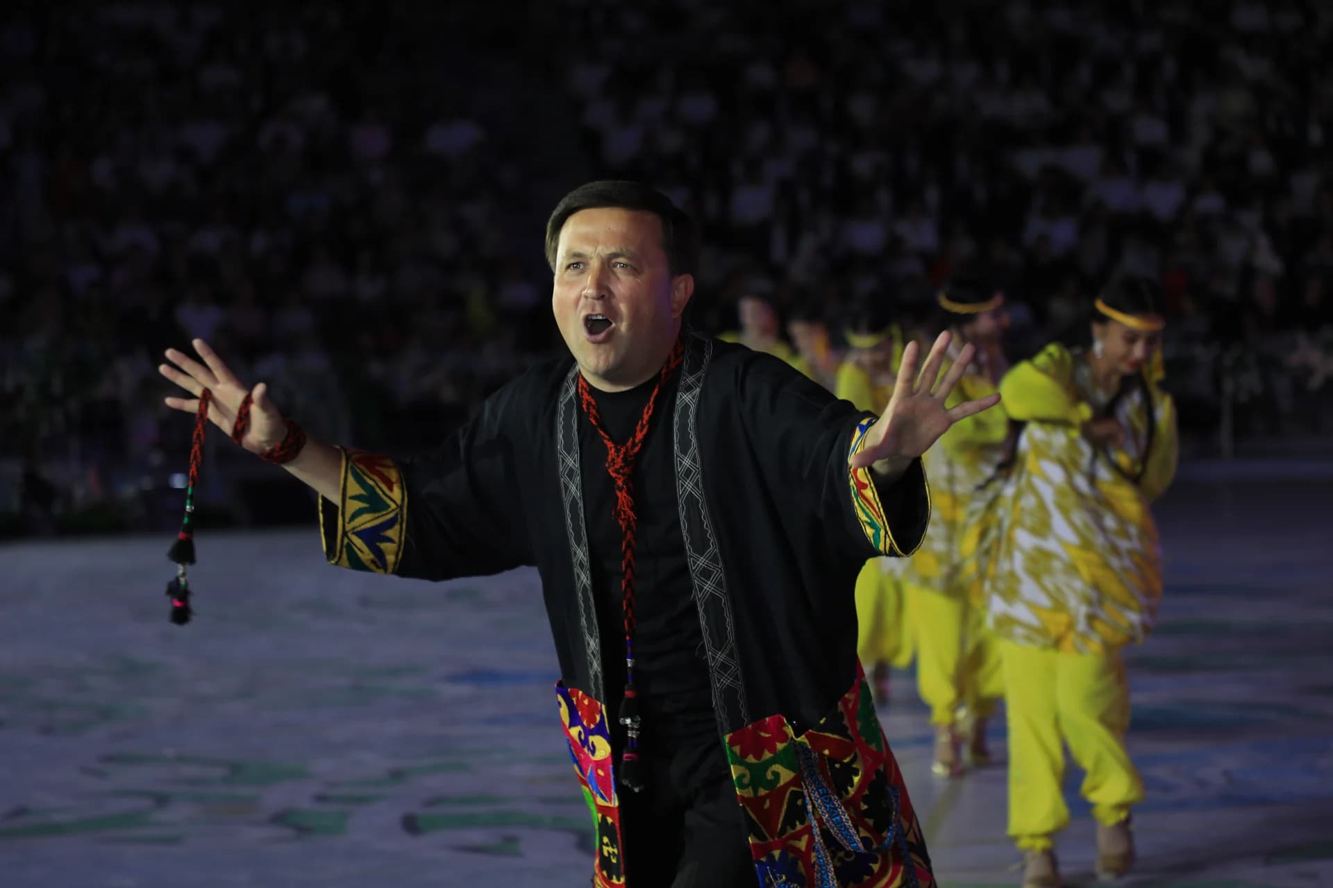 Performer in traditional costume during stage event