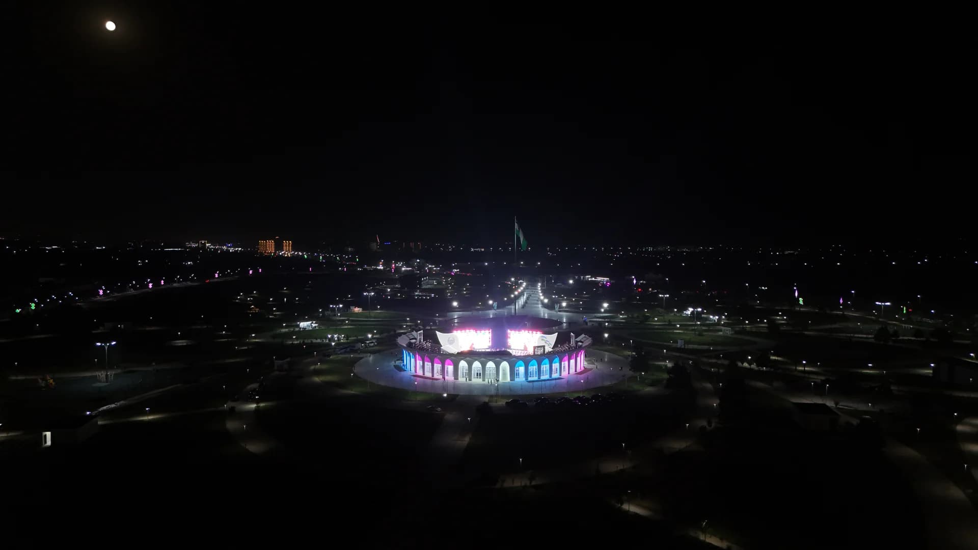 Illuminated amphitheater building at night