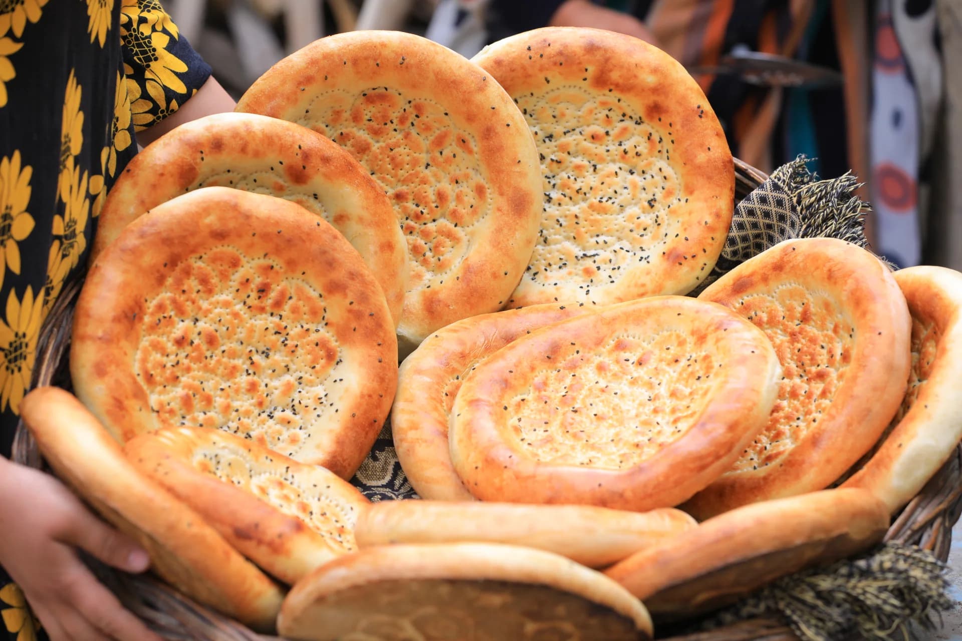 Basket filled with freshly baked round flatbreads