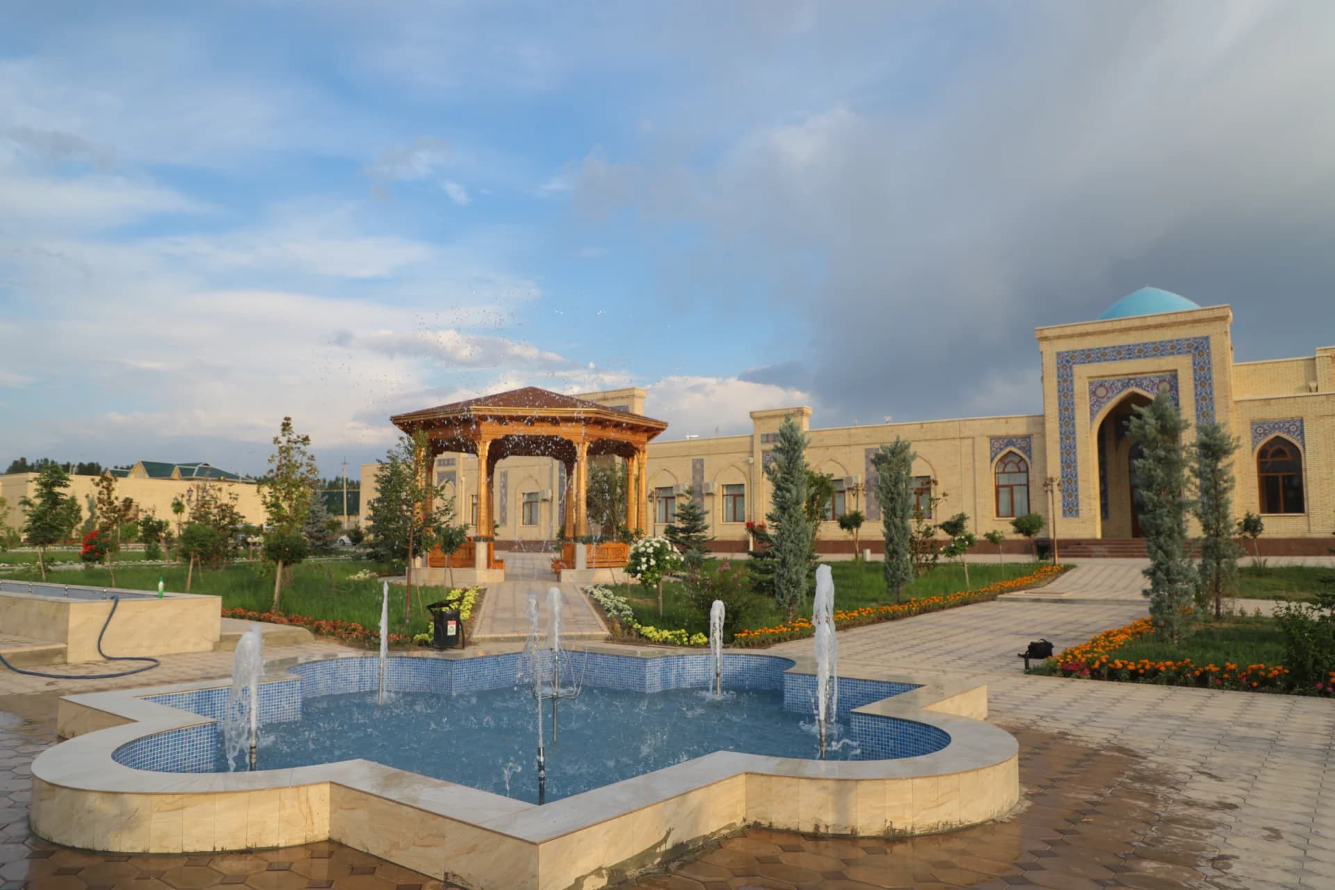 Outdoor courtyard featuring fountains and architectural structures