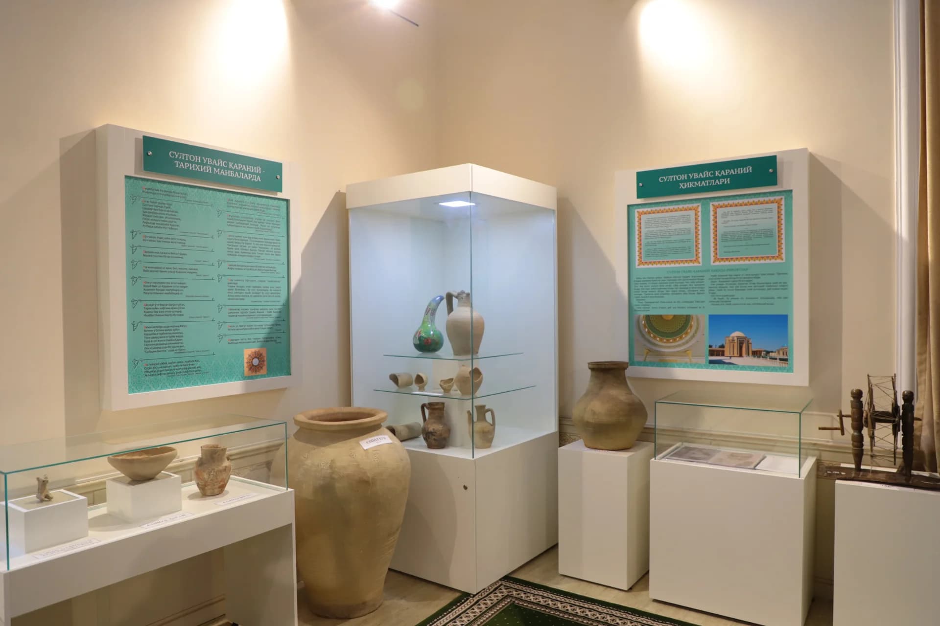 Historical artifacts and ceramic vessels displayed inside a museum room