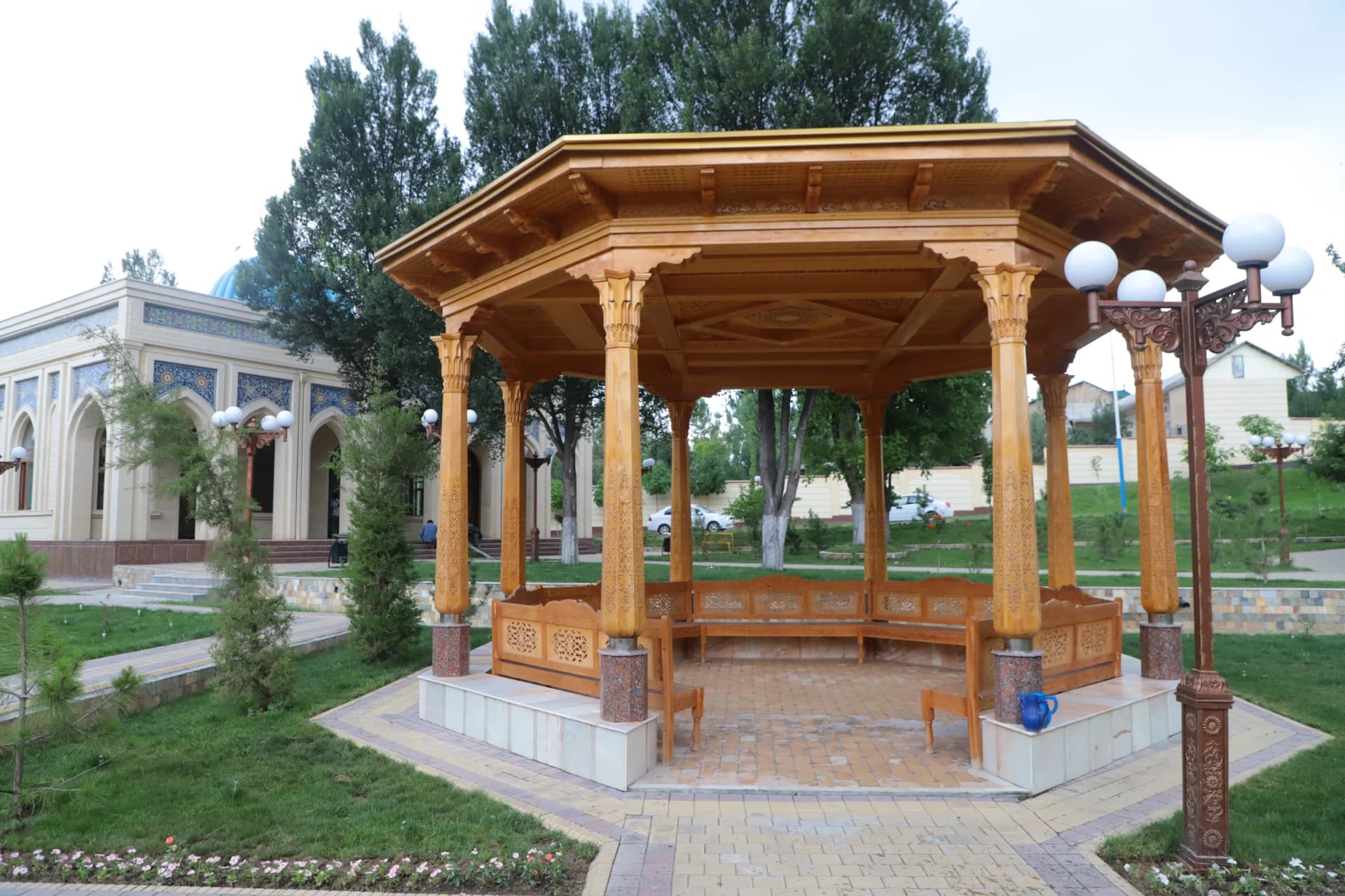 Carved wooden gazebo in park setting