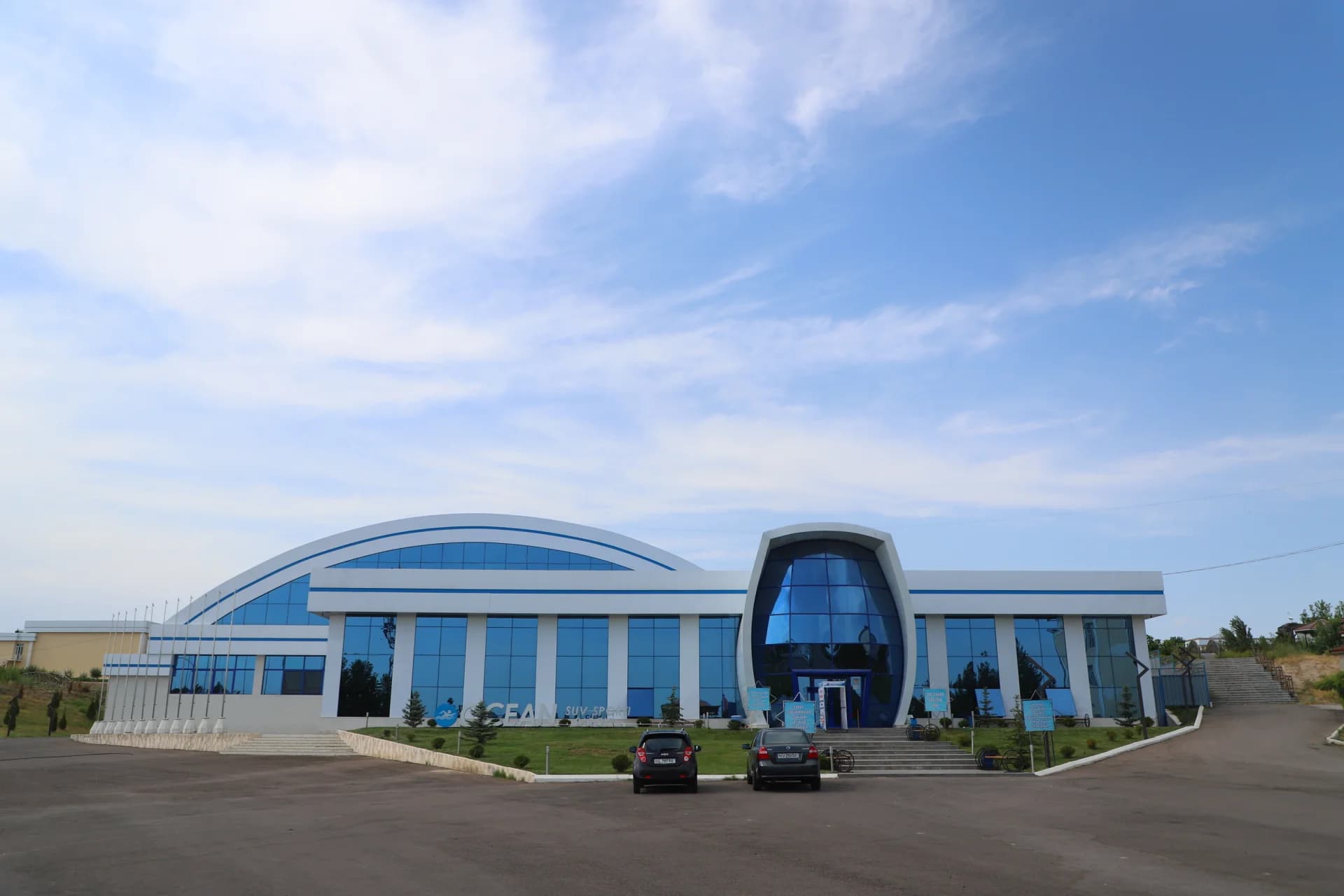 Modern sports and recreation complex building exterior with glass facade