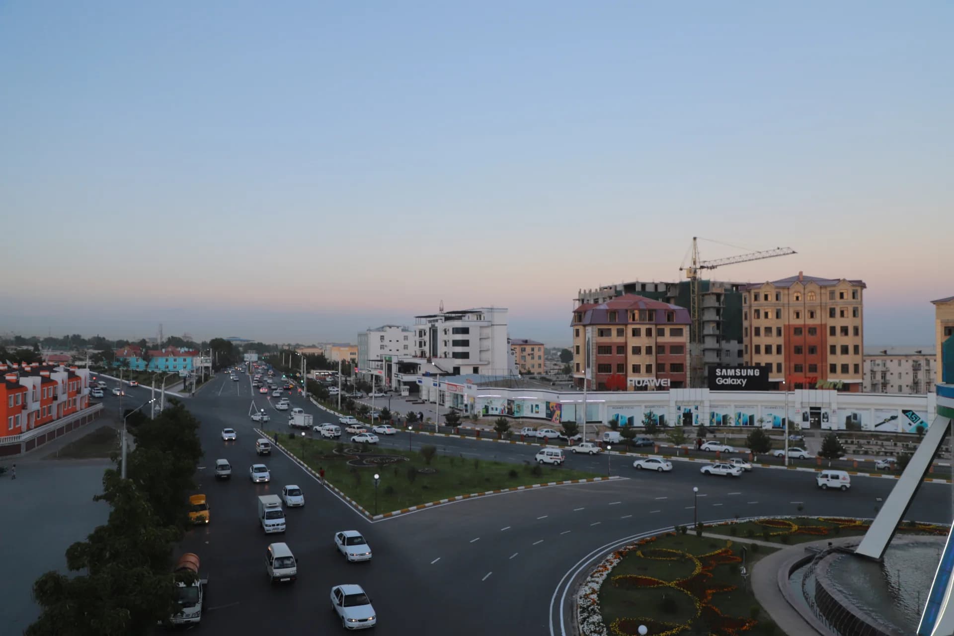 City street scene with vehicular traffic and urban buildings