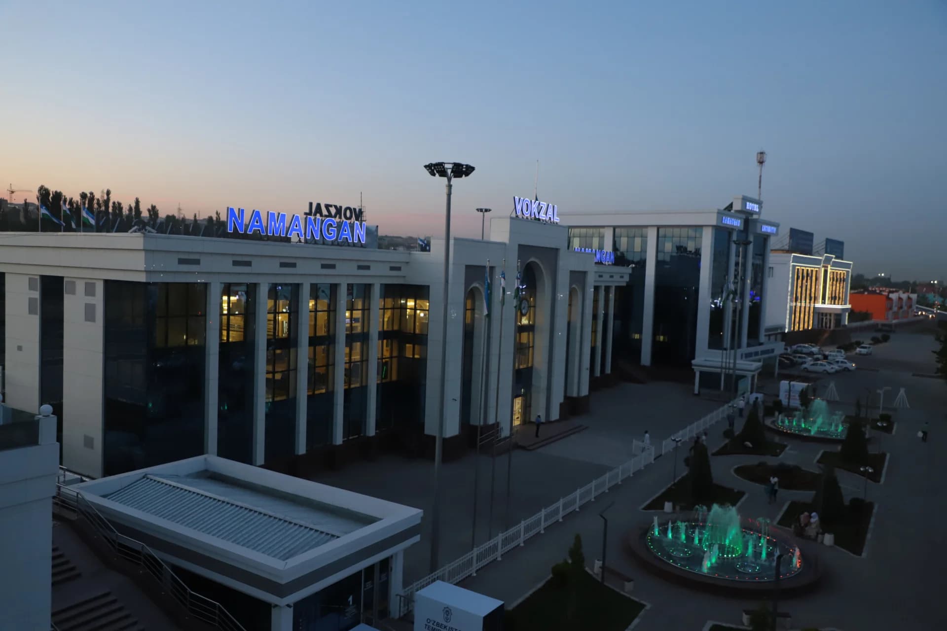 Exterior view of Namangan railway station building at dusk