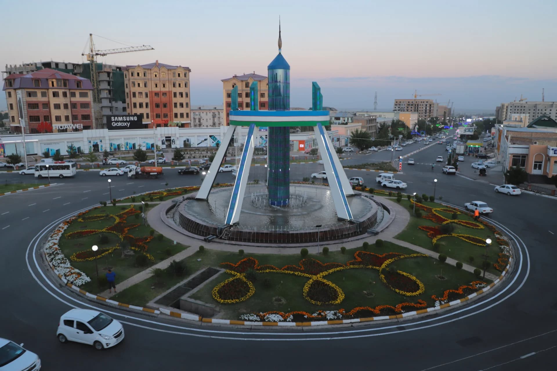 City roundabout with a central monument and fountain
