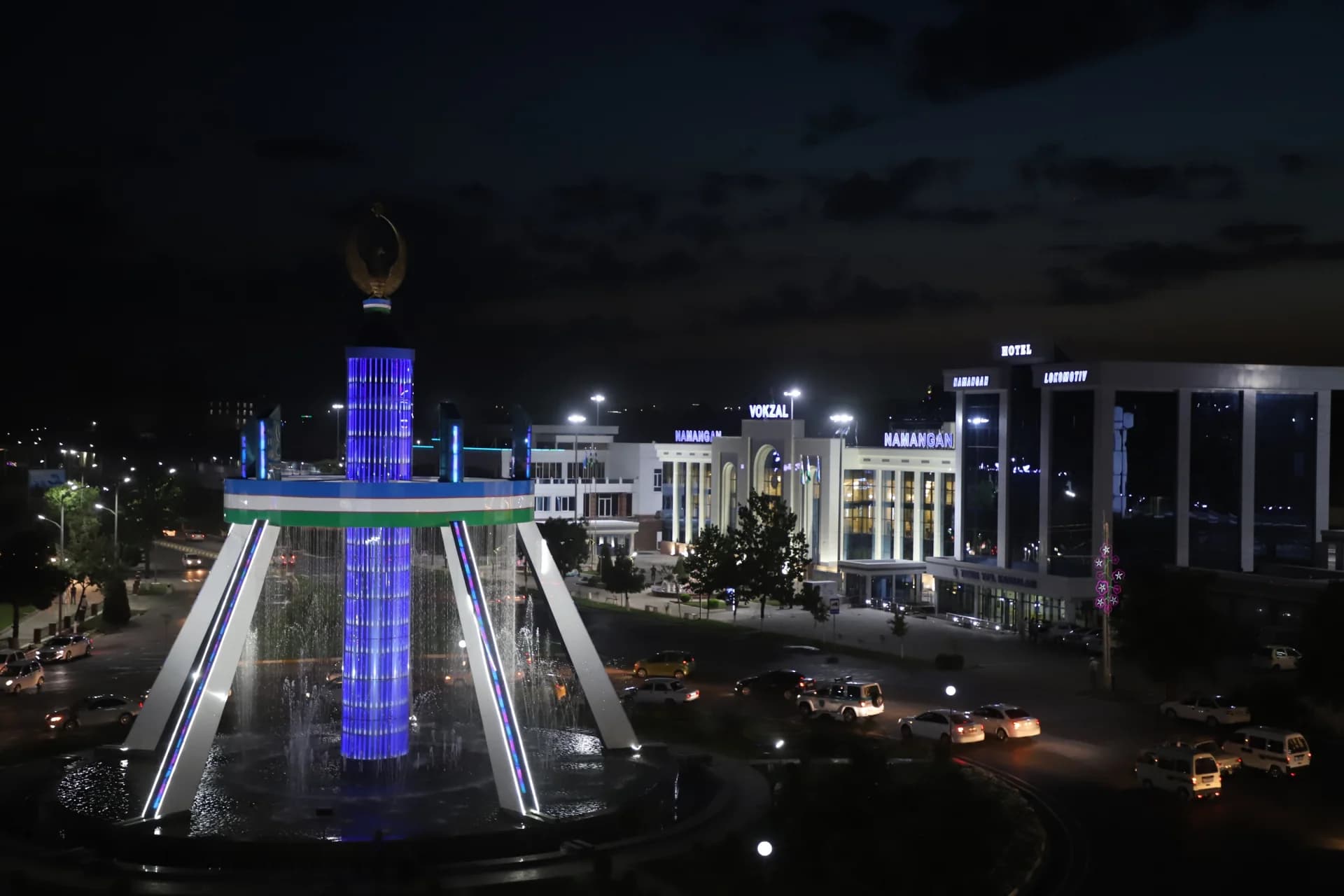 Illuminated fountain and buildings at night
