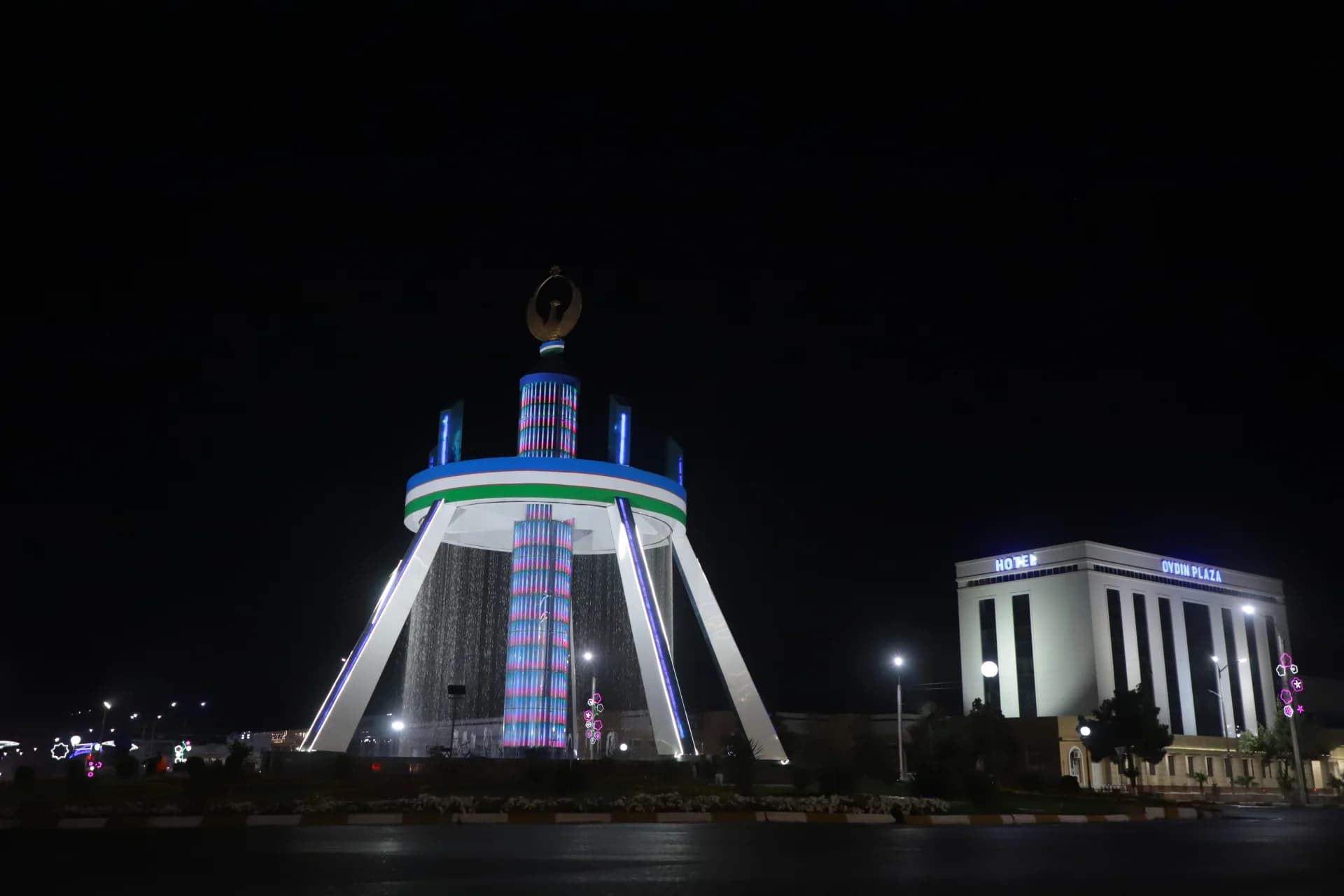 Illuminated fountain structure at night