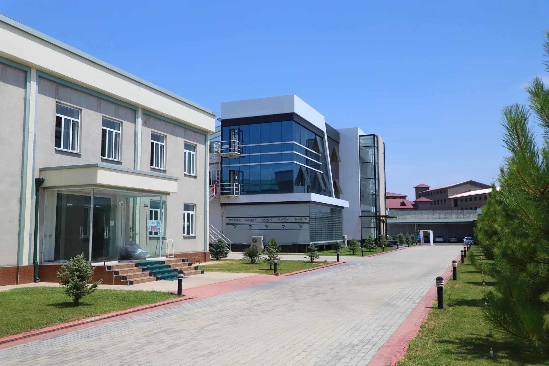 Modern buildings along a paved walkway