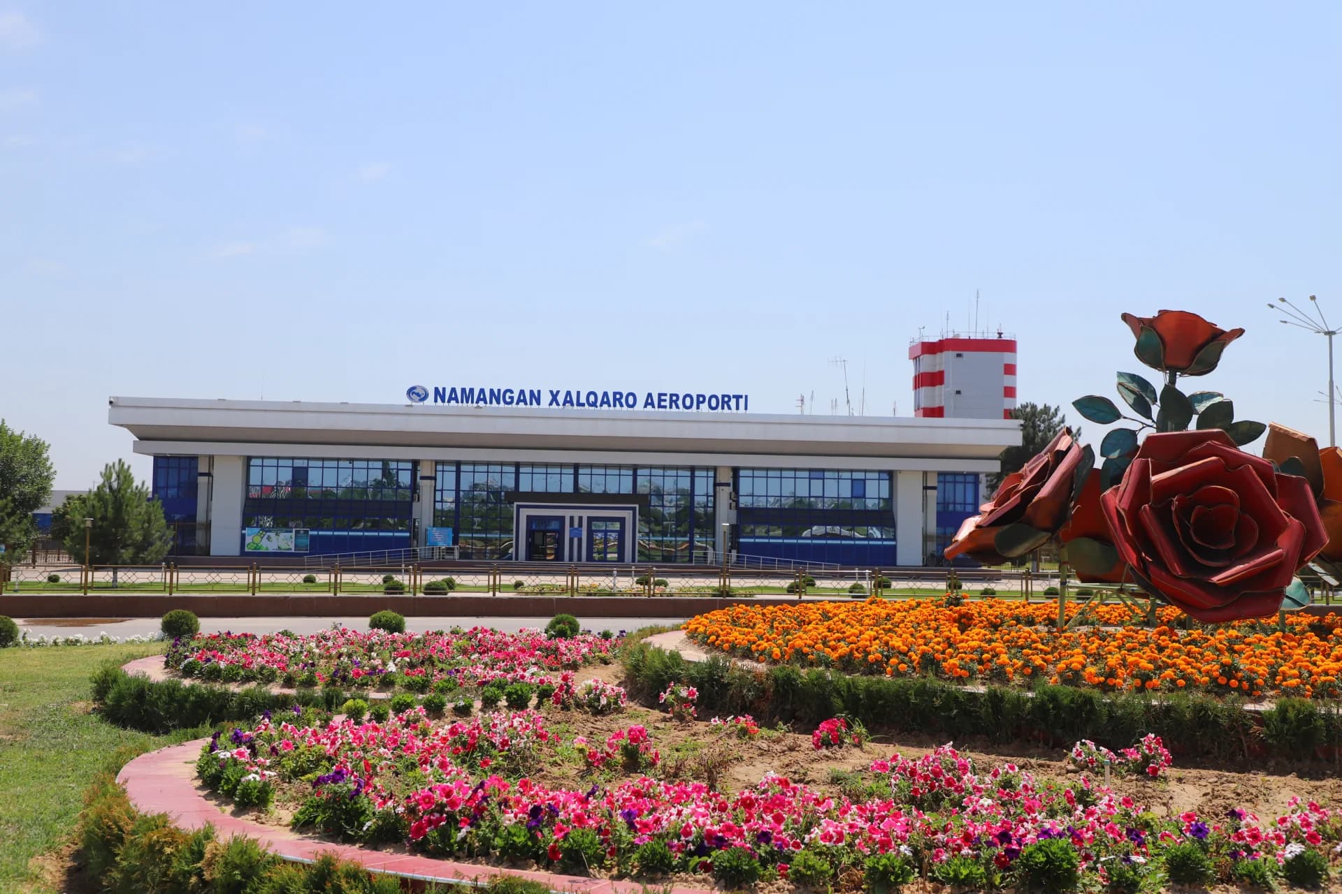Airport building exterior with flower beds
