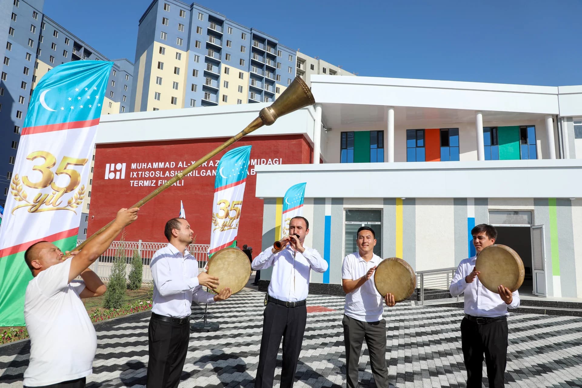 People playing traditional musical instruments outdoors