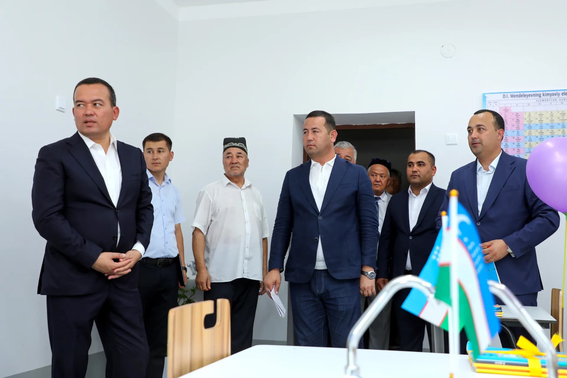Group of men standing indoors
