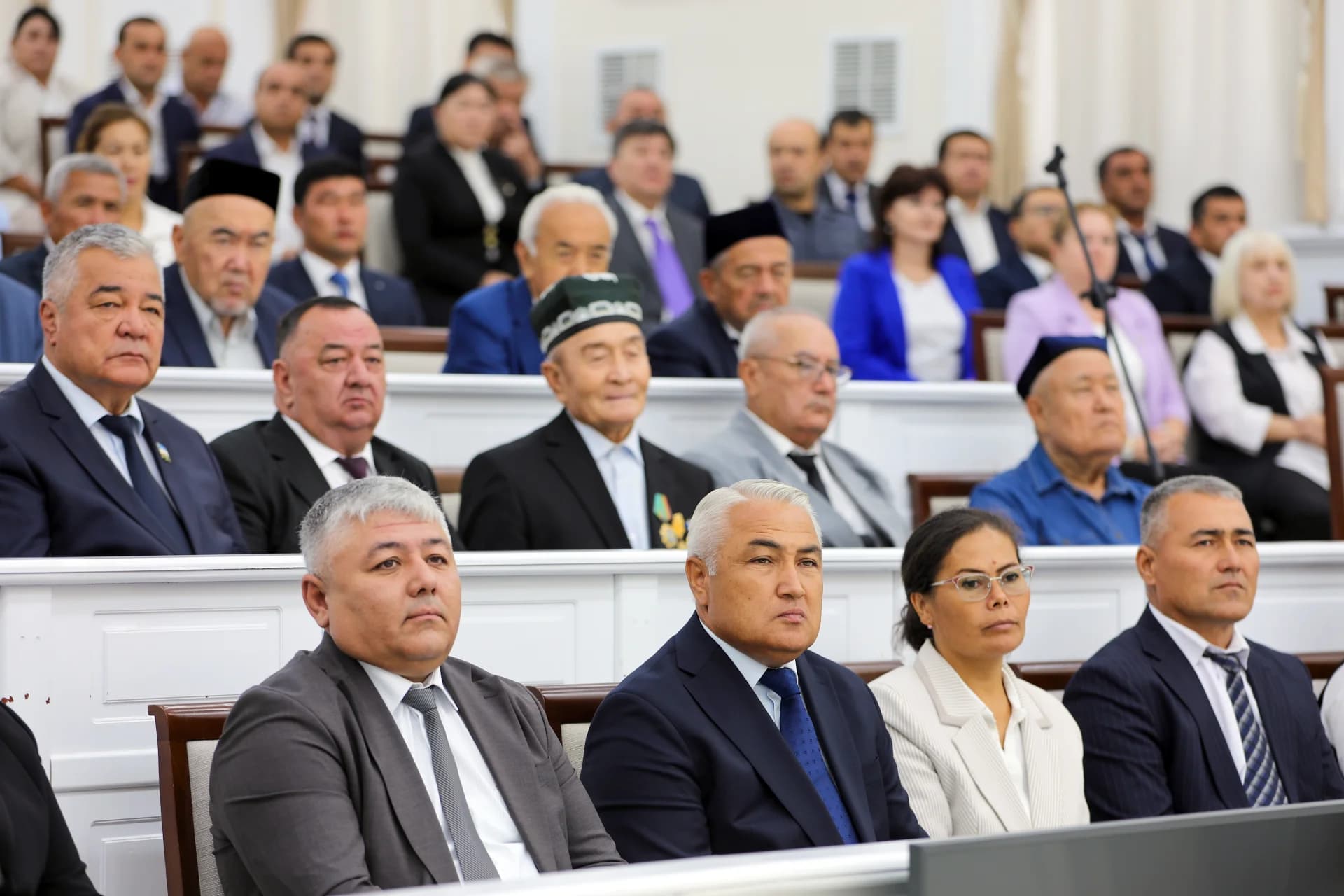 People seated in an assembly hall