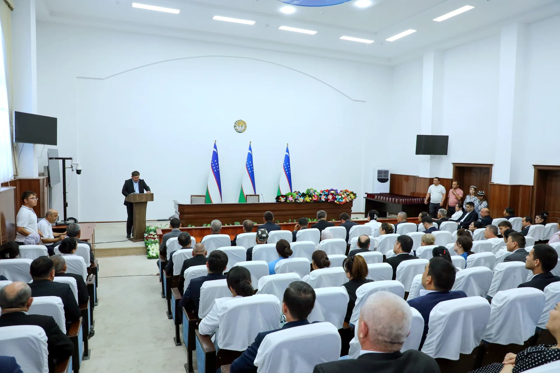 People attending a meeting in a conference hall