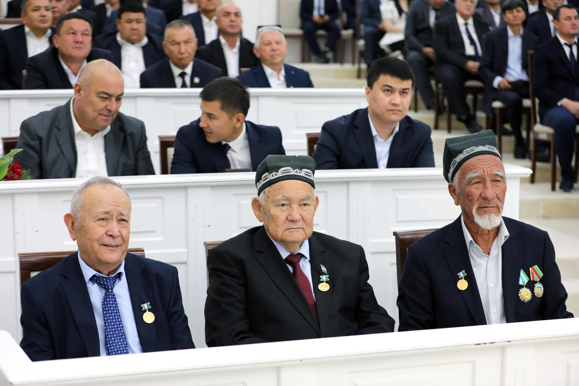 People seated in an assembly hall