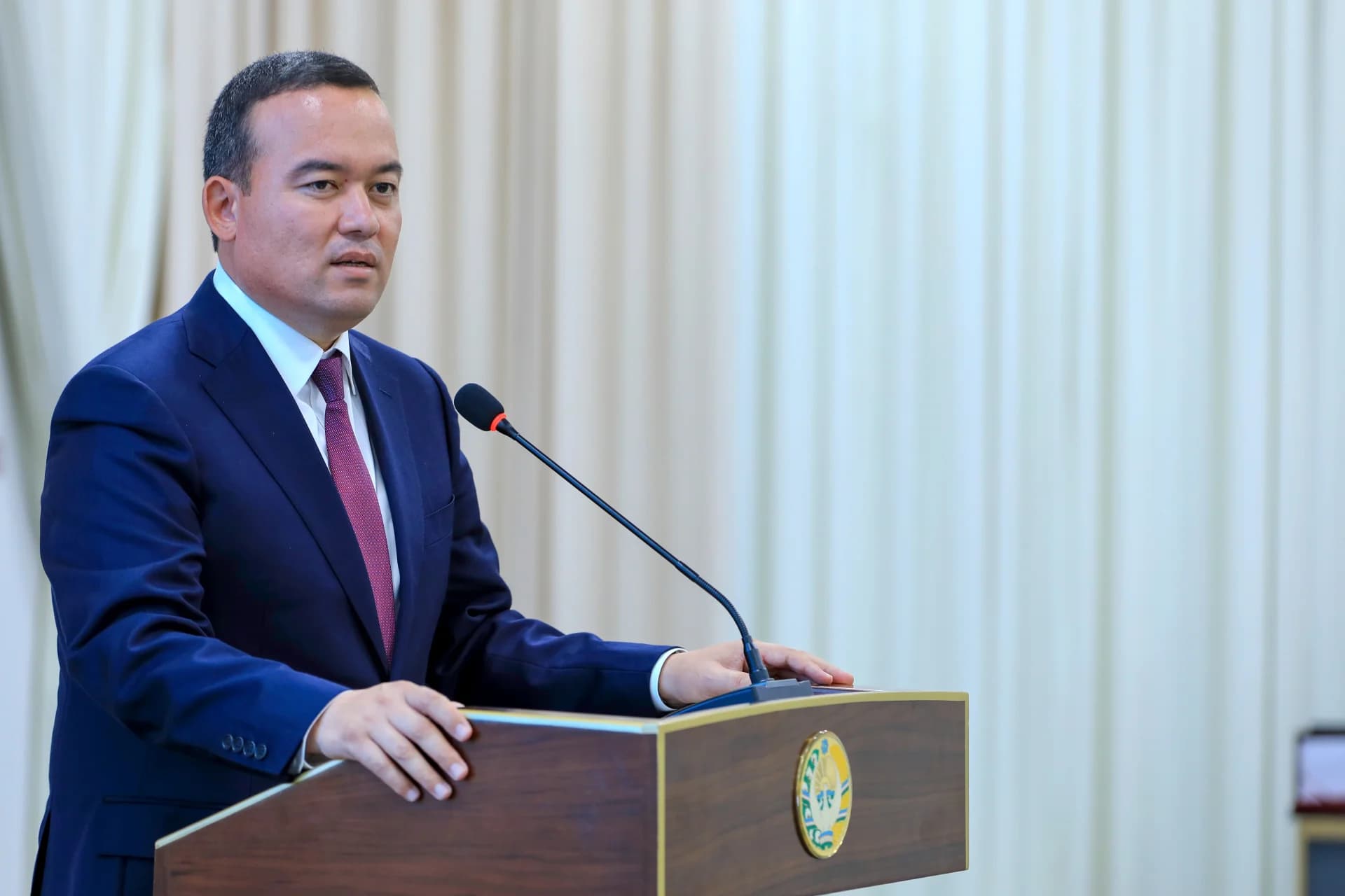 Man speaking at a podium
