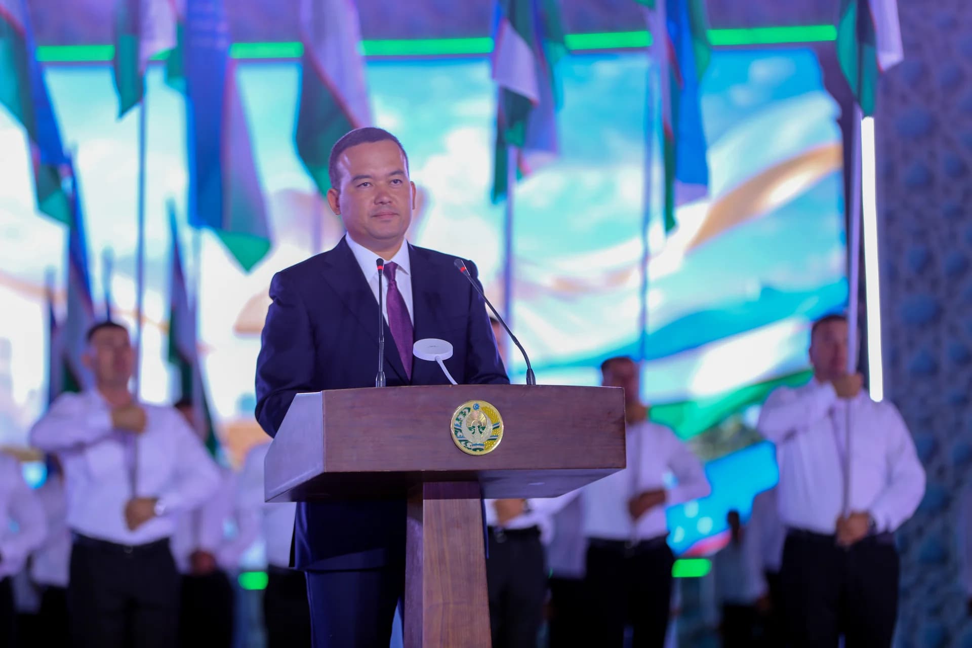 Person speaking at a podium during a public event