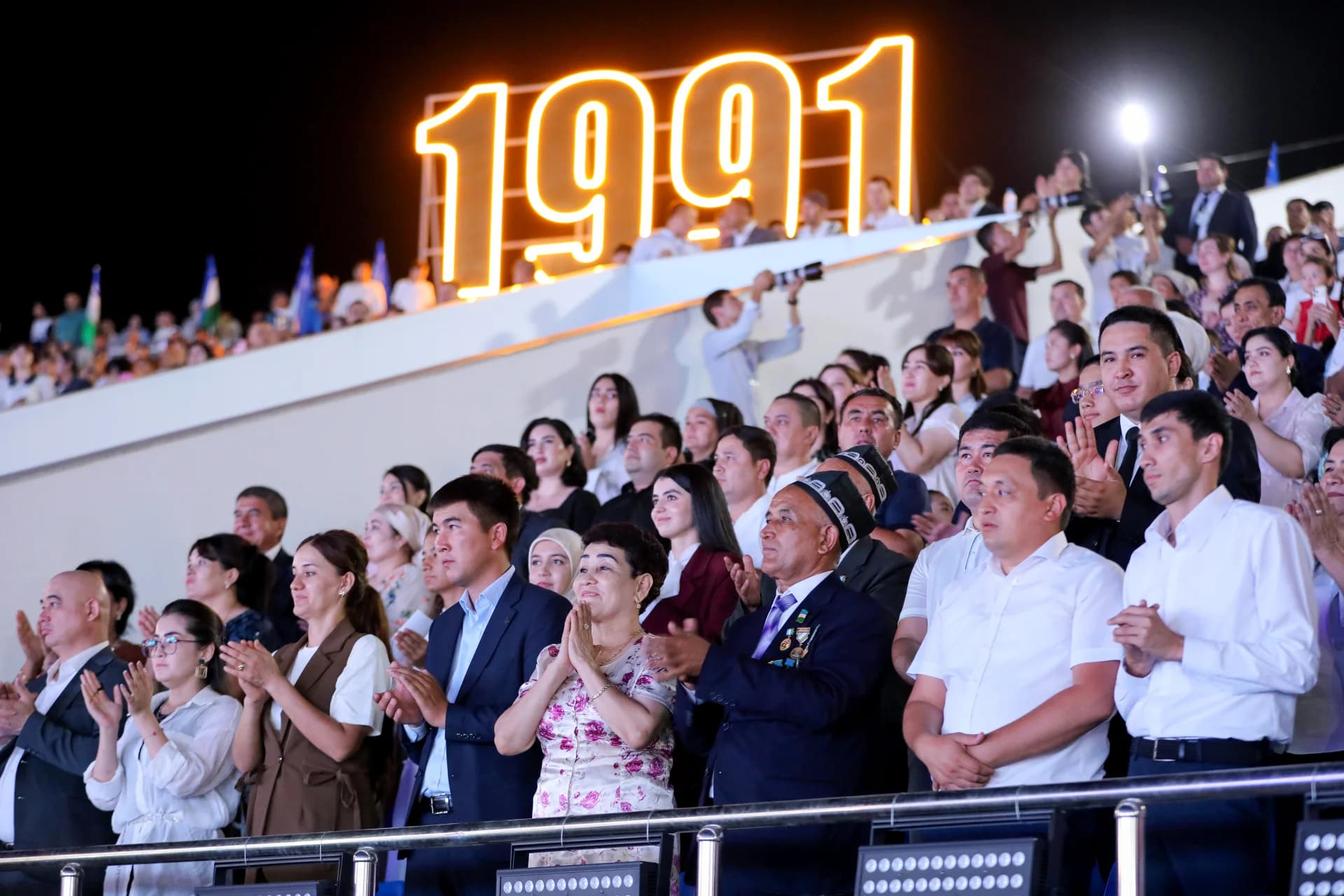 People gathered in a stadium watching an event