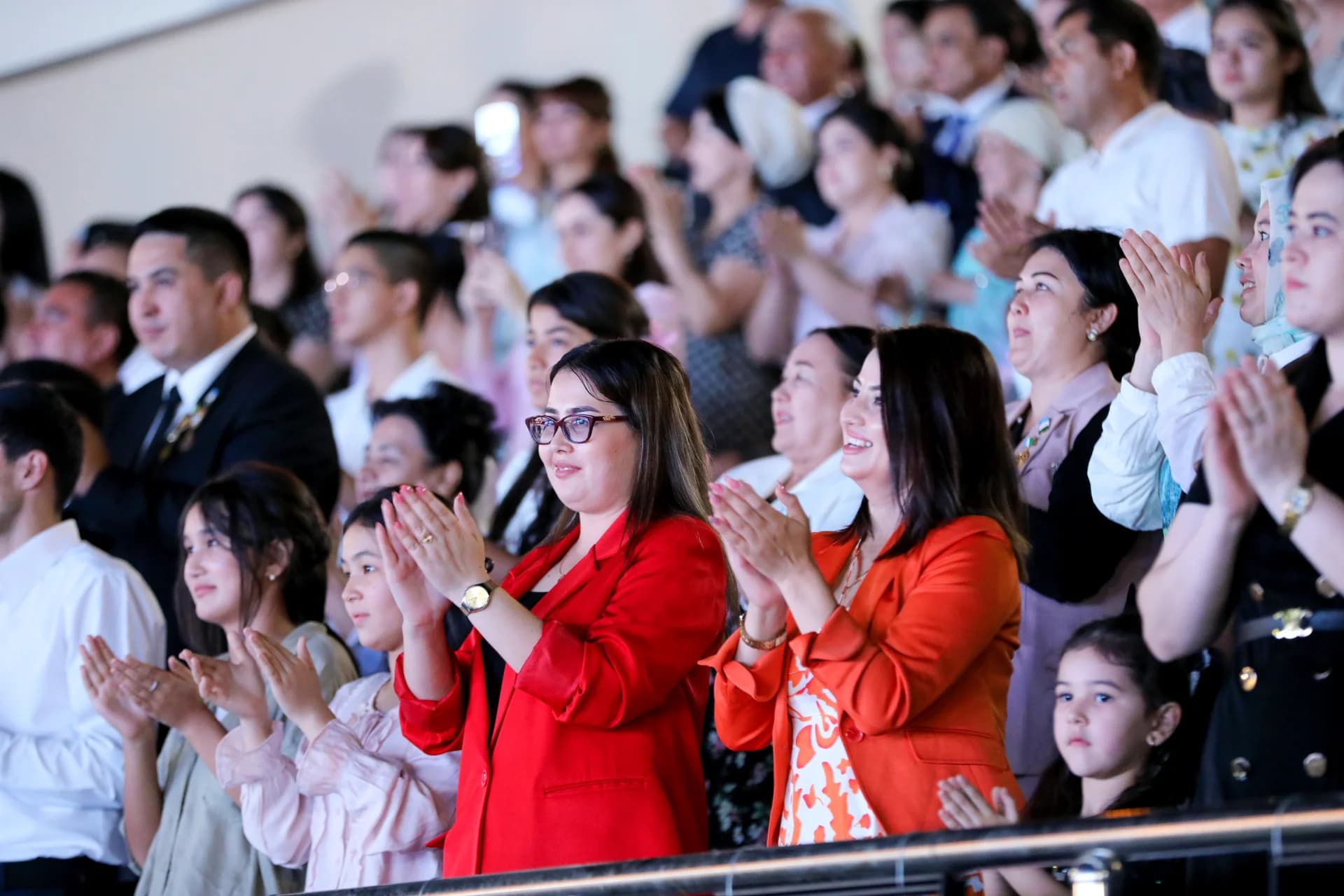 People clapping in an audience