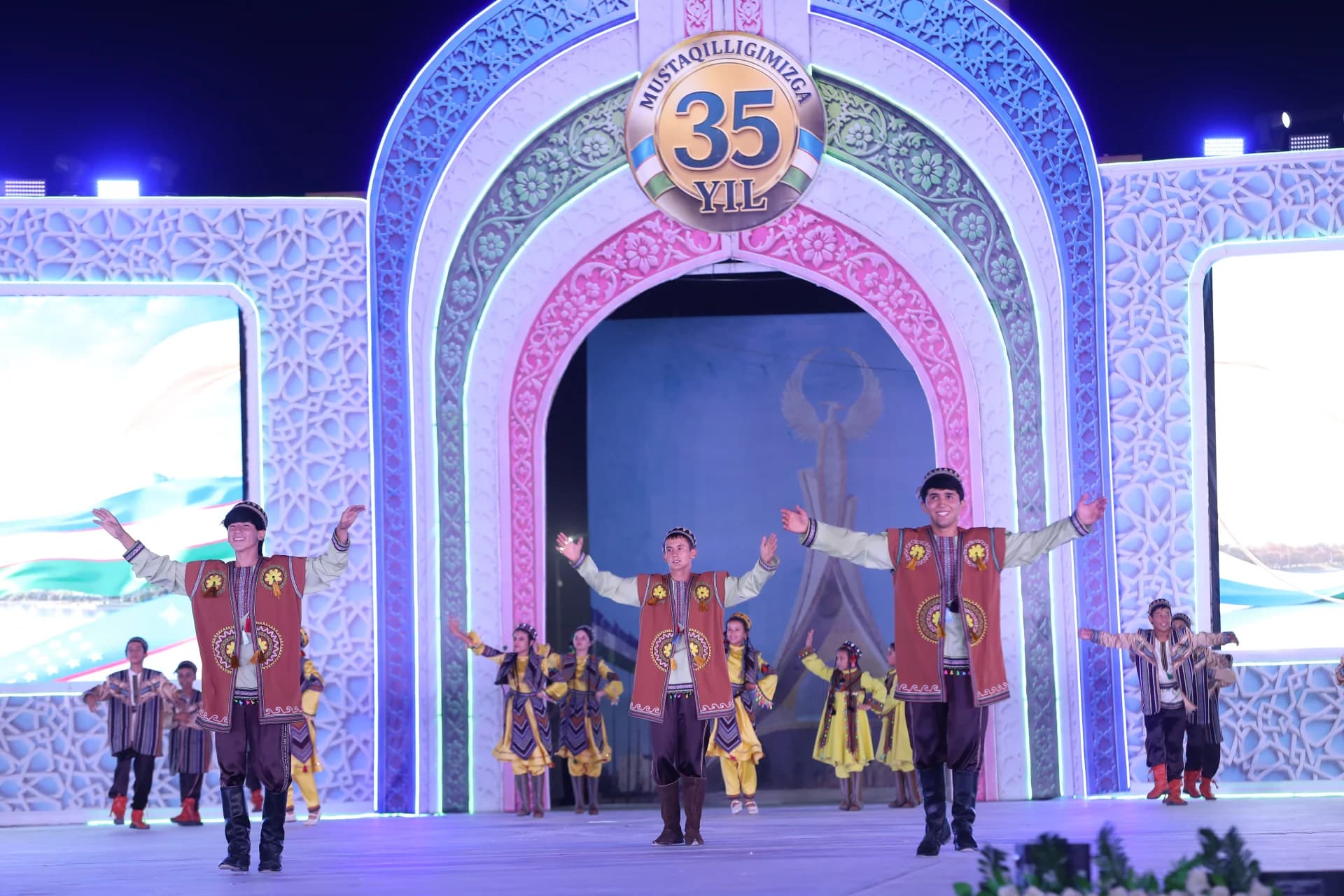 Performers in traditional clothing dancing on stage